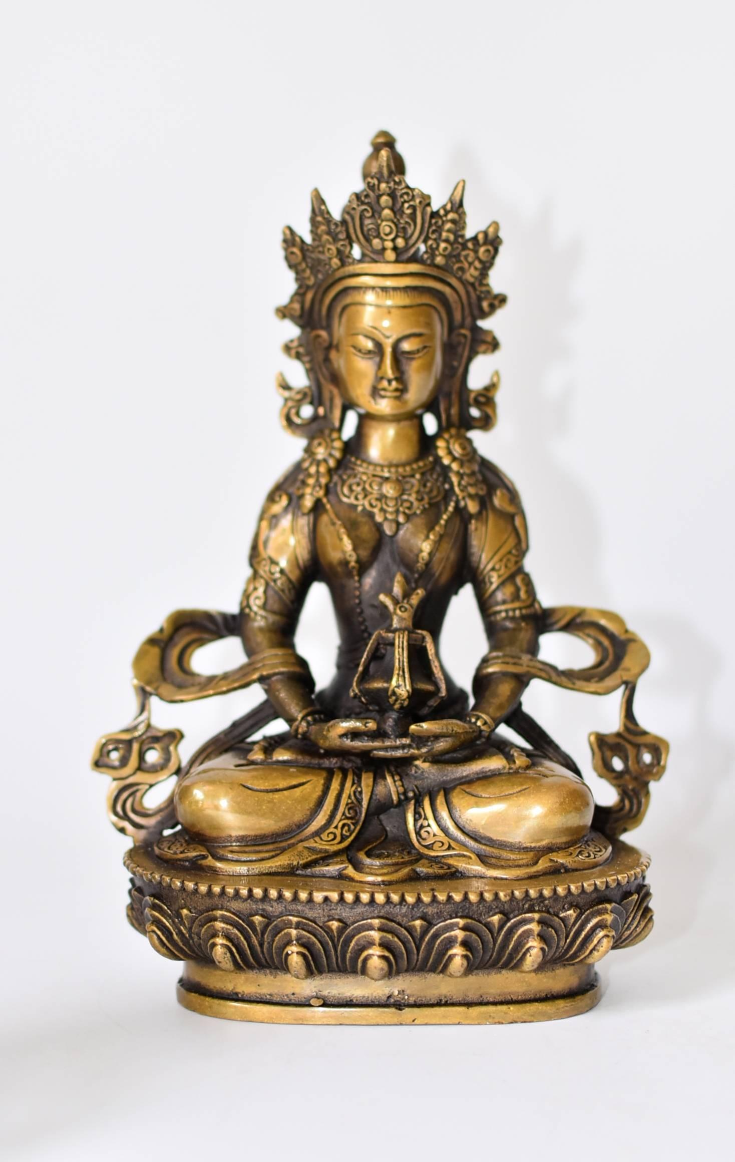 A spectacular collection featuring three Tibetan Buddhas. Manjushri, the Bodhisattva of Wisdom, holds a sword in one hand, to cut off all delusion. A book of Prajnaparamita Wisdom text is in the flowers to his left. Prajnaparamita (Perfection of