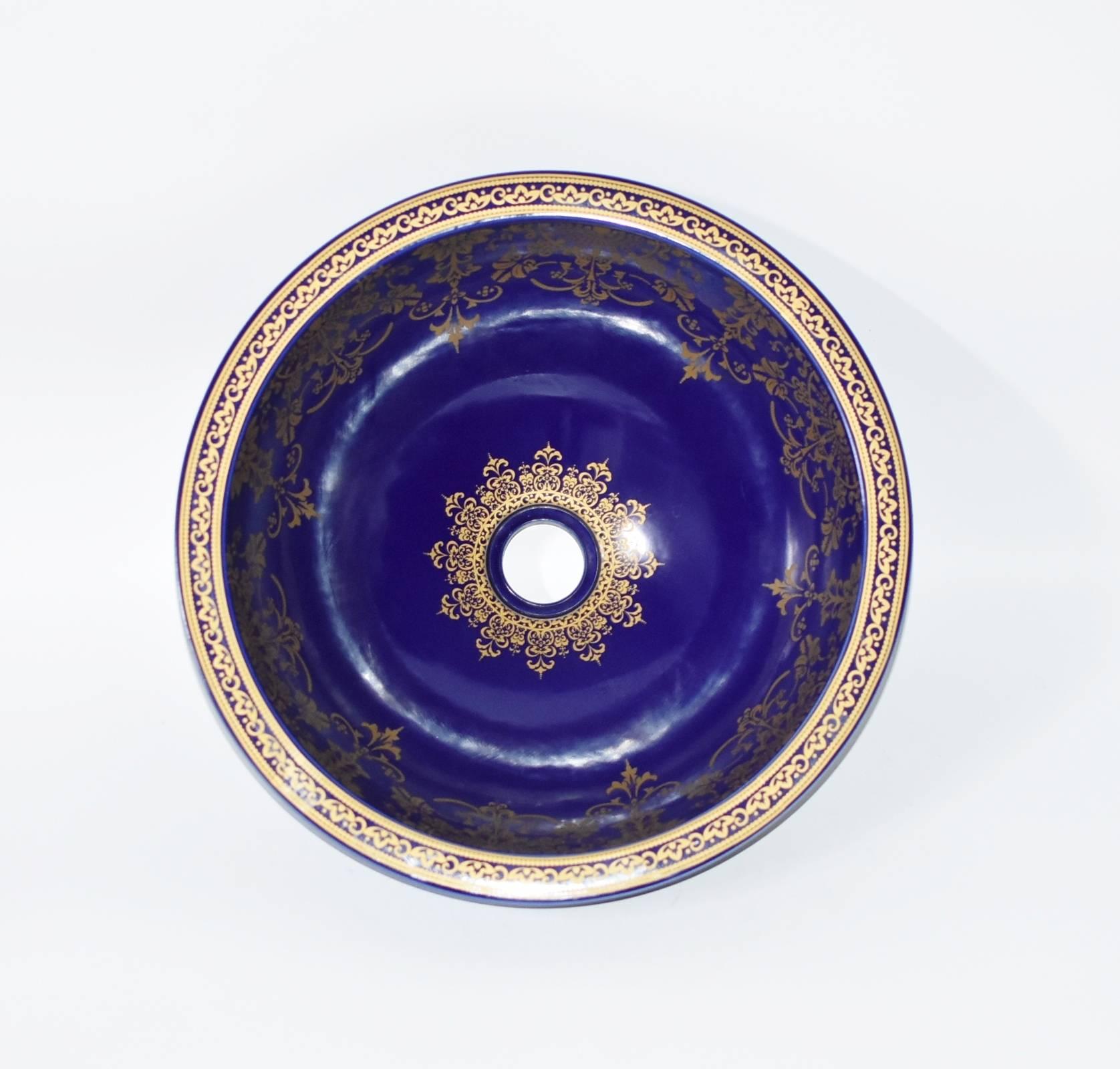 Beautiful cobalt blue sink with delicate golden cascading flowers. The sink is heavy and substantial, rings like a bell. Gorgeous blue is saturated and striking. Exterior gloss scroll artworks. One of a kind. Luxurious and exquisite, artistic and
