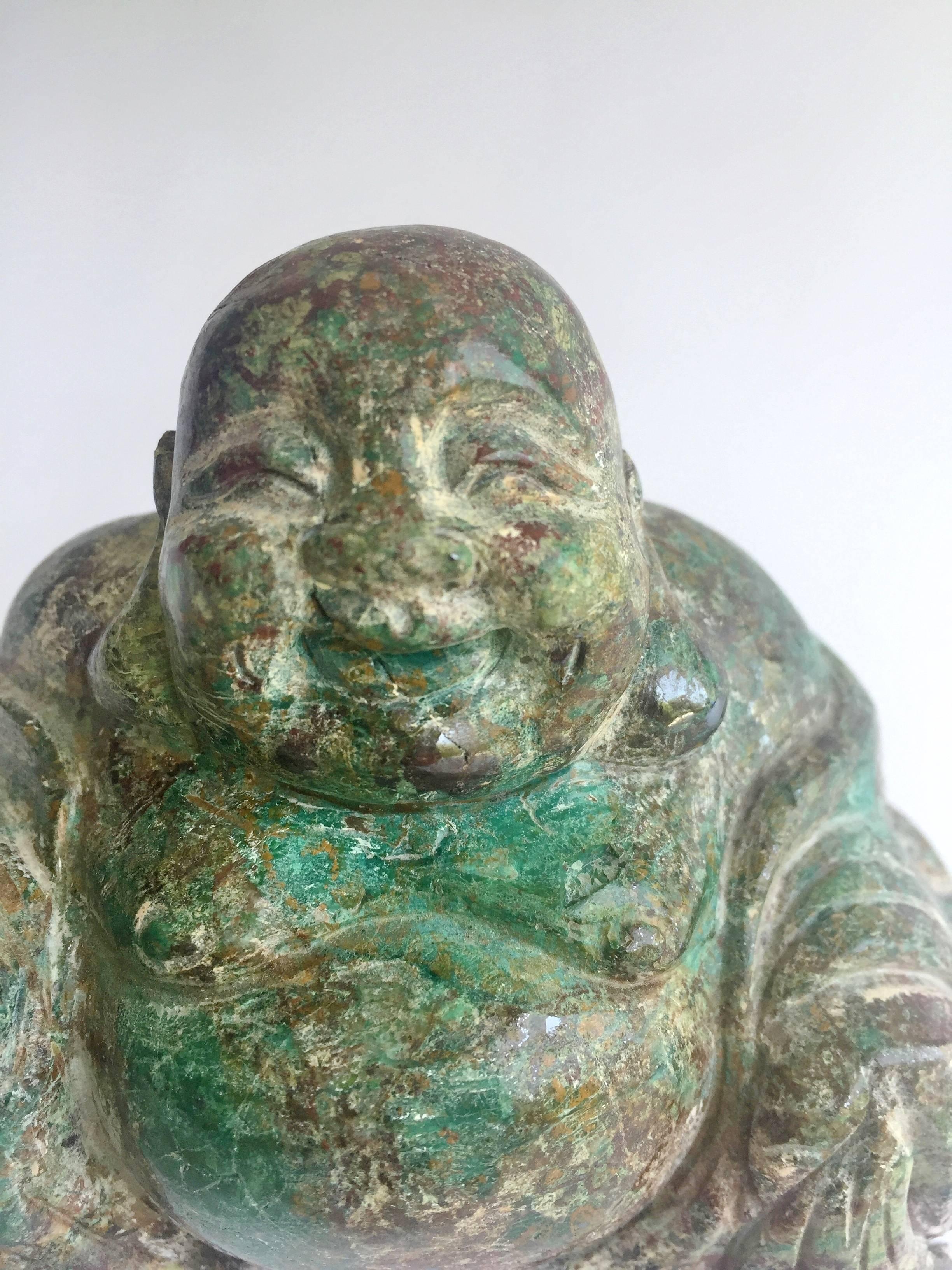 This wonderful chrysocolla sculpture features the beloved Chinese happy Buddha. His expression is just so delightful. Chrysocolla is a gemstone that has the powerful of attraction and love. Put it near you and it is believed to bring love.