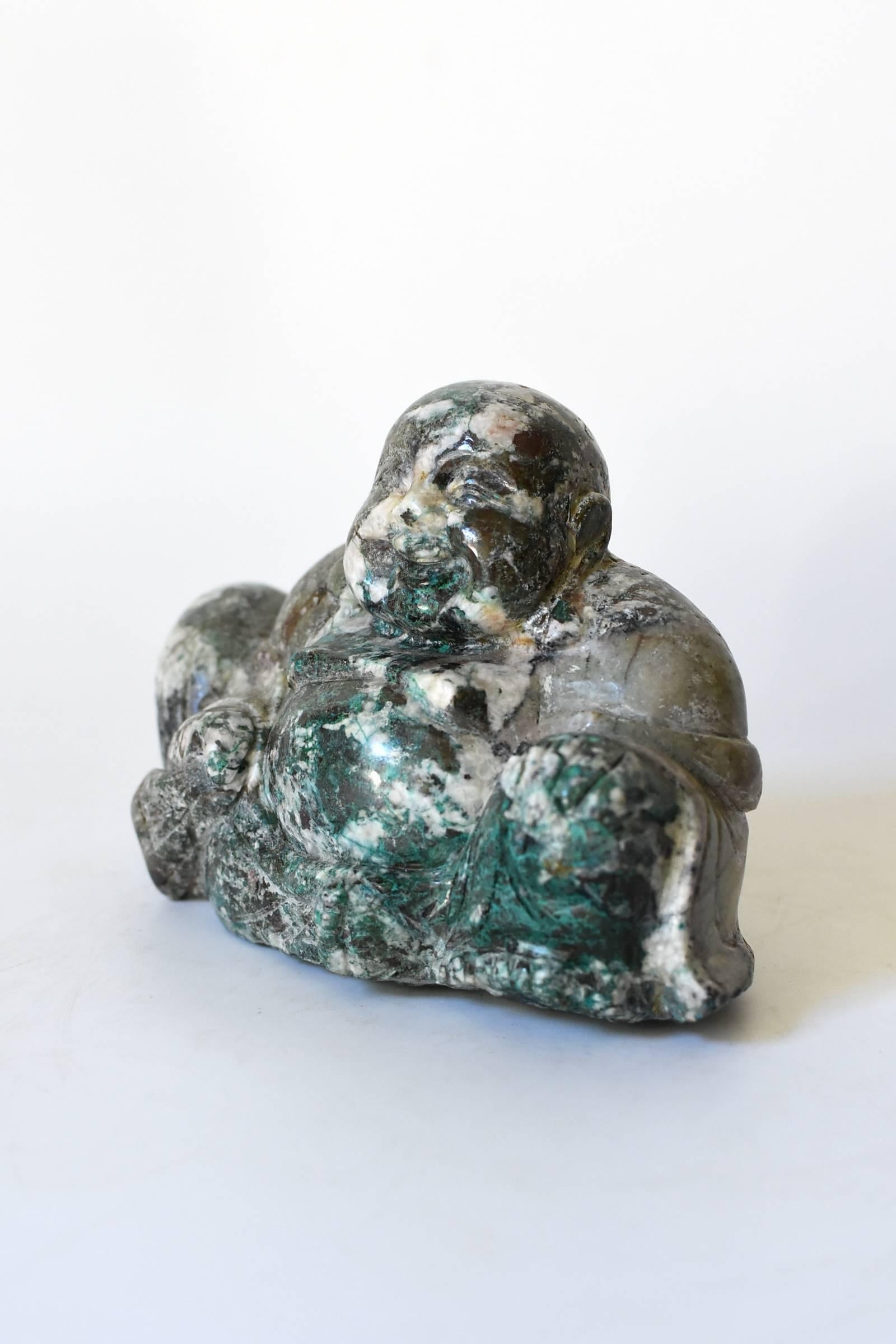 This wonderful chrysocolla sculpture features the beloved Chinese Happy Buddha. His expression is just so delightful. Chrysocolla is a gemstone that has the powerful of attraction and love. Put it near you and it is believed to bring love.