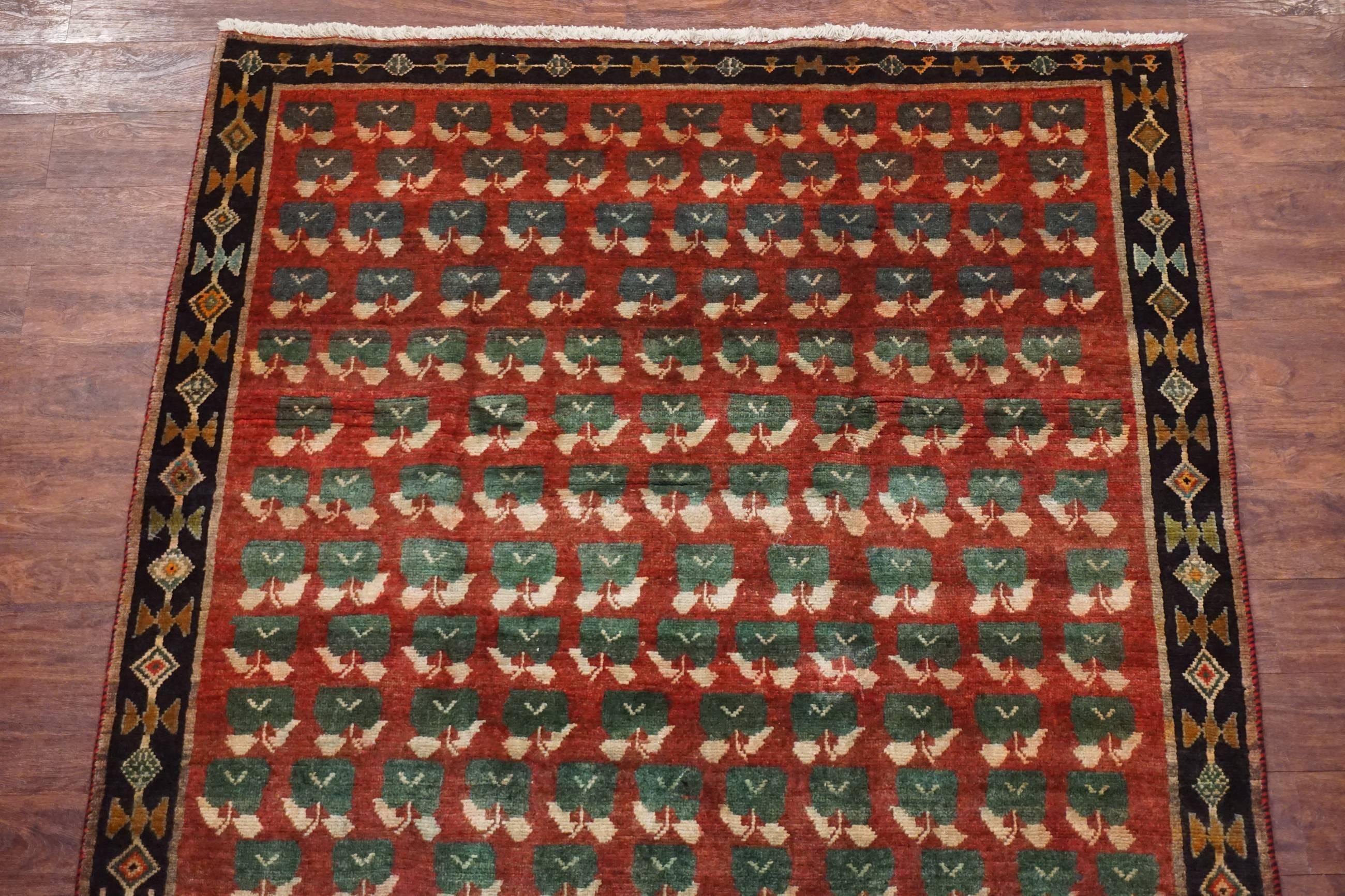 Hand-Knotted Antique Persian Tribal Rug with Flower Motif, circa 1940 For Sale
