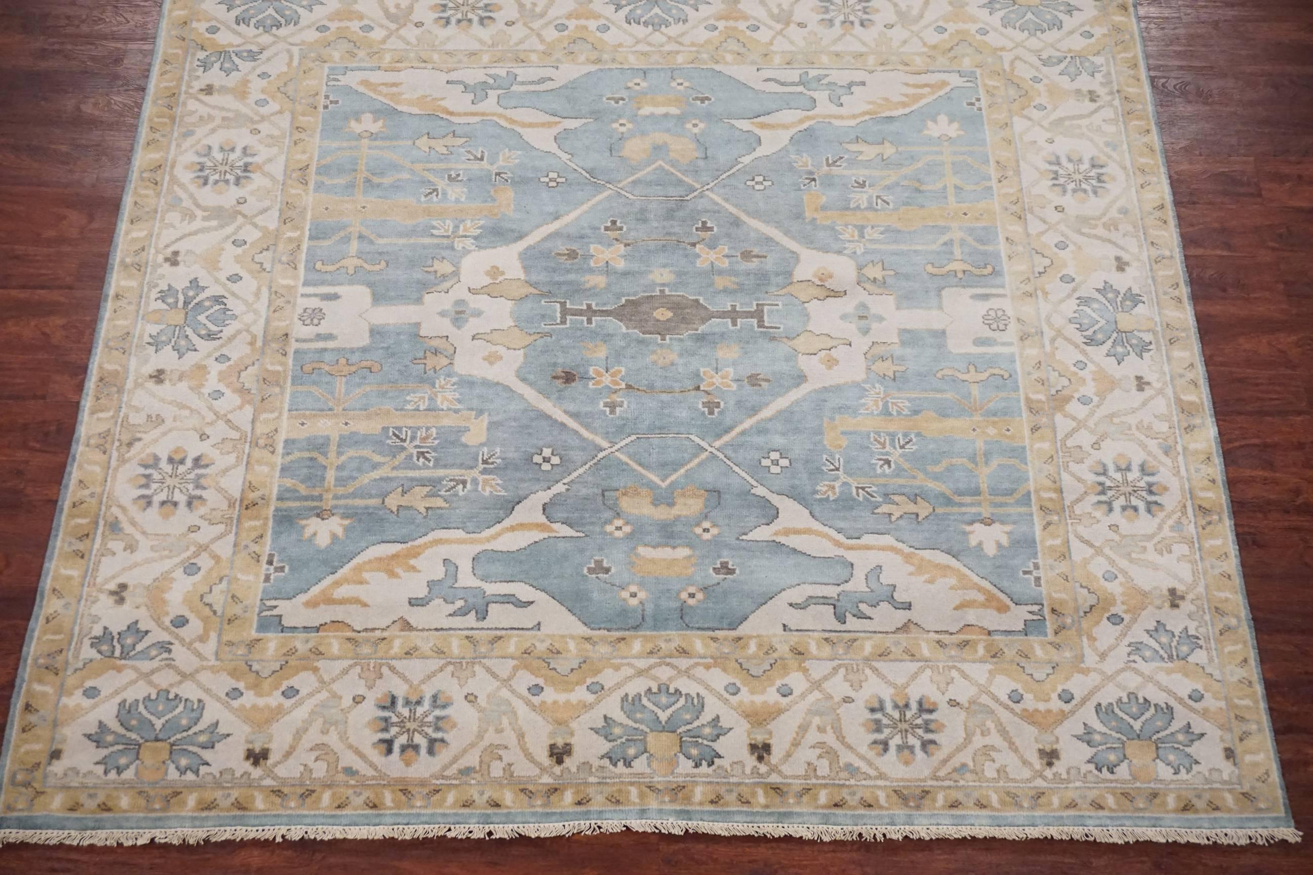 Light-blue square Oushak design rug, 

2010

Measures: 7' 10