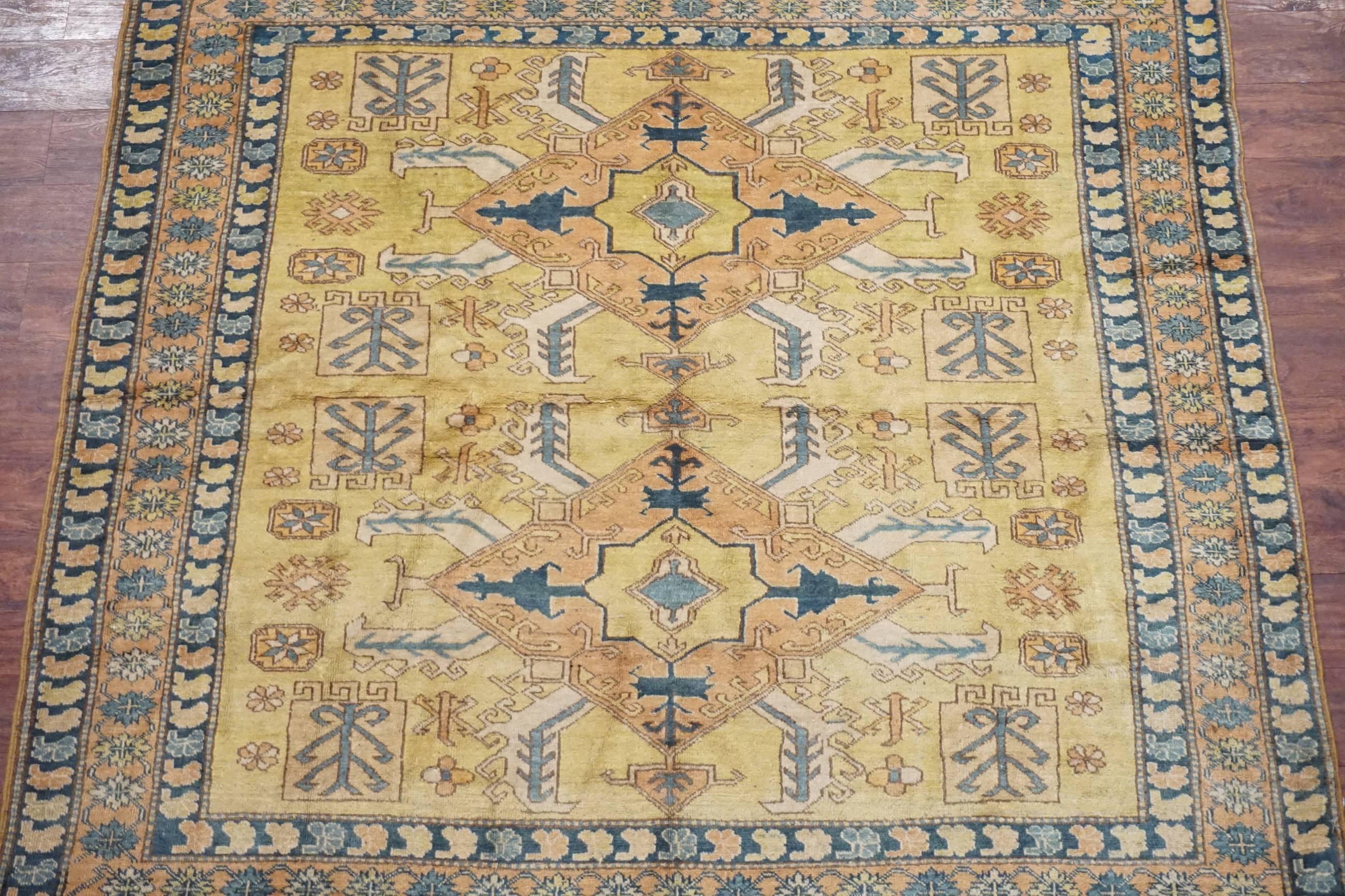 Antique square Caucasus Kazak rug

circa 1900

Measure: 6' x 6'

Hand-knotted wool pile on a cotton foundation

Field color: Gold
Border color: Salmon
Accent color: Ivory, navy-blue, light-blue.