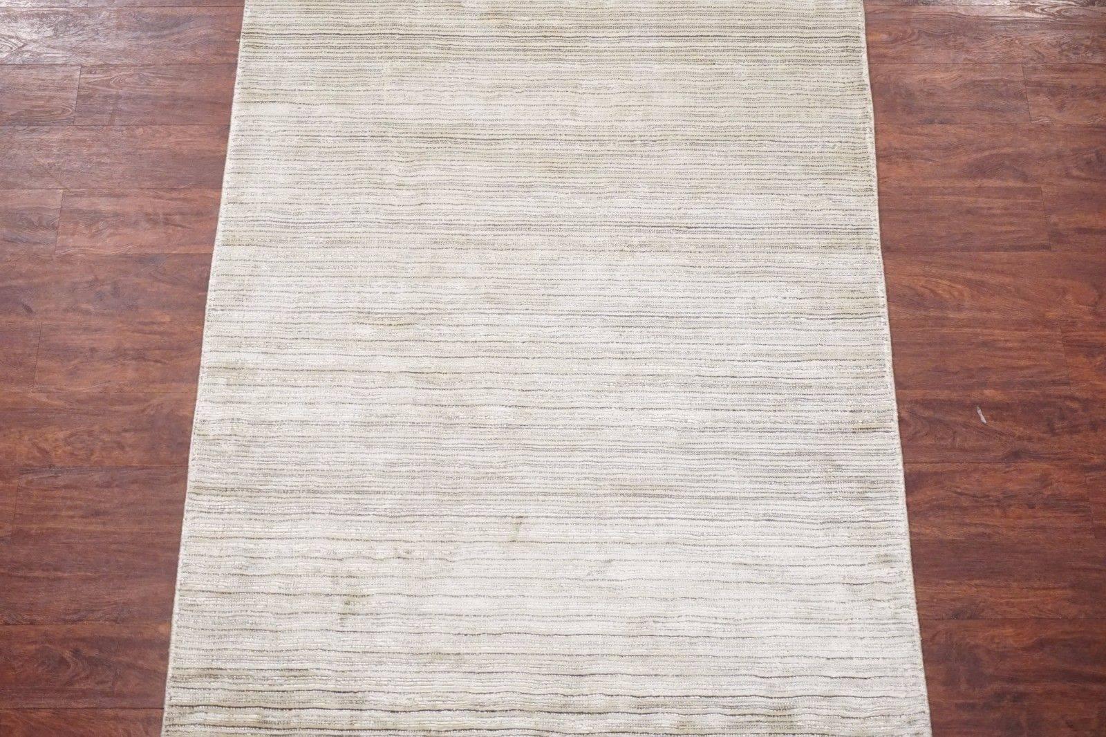 Small modern bamboo silk area rug with striped design

2015

Measures: 4' x 5' 10