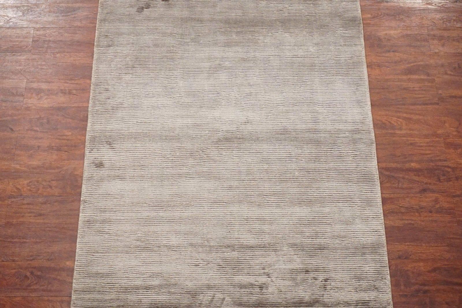 Modern bamboo silk area rug with striped design

2015

Measures: 4' x 6'

Handmade bamboo silk pile, cotton foundation

Field: Silvered-Brown