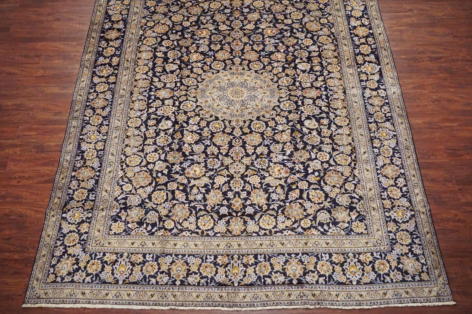 Signed blue Persian Kashan rug

circa 1940

Measures: 9'11