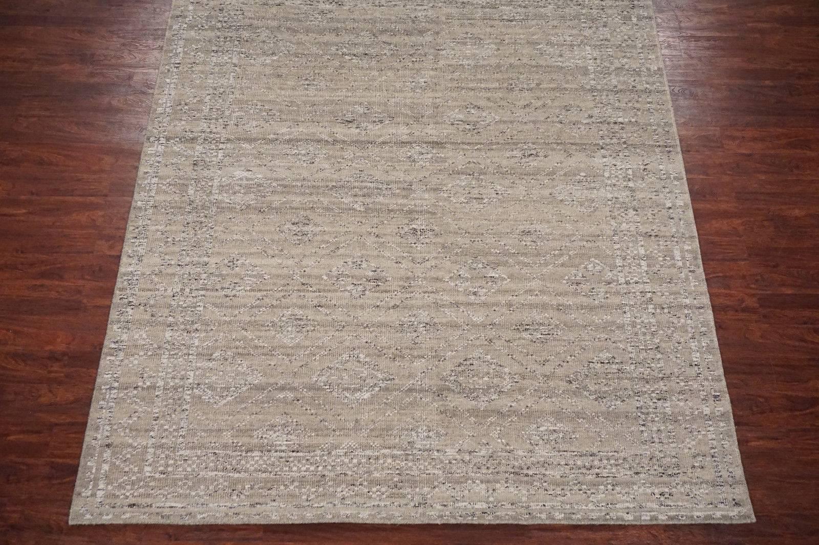 Modern Moroccan design rug

circa 2015

Measures: 8' x 10'

Hand-knotted wool pile, cotton foundation

Field color: Beige
Border color: Light-brown
Accent color: Ivory and brown.