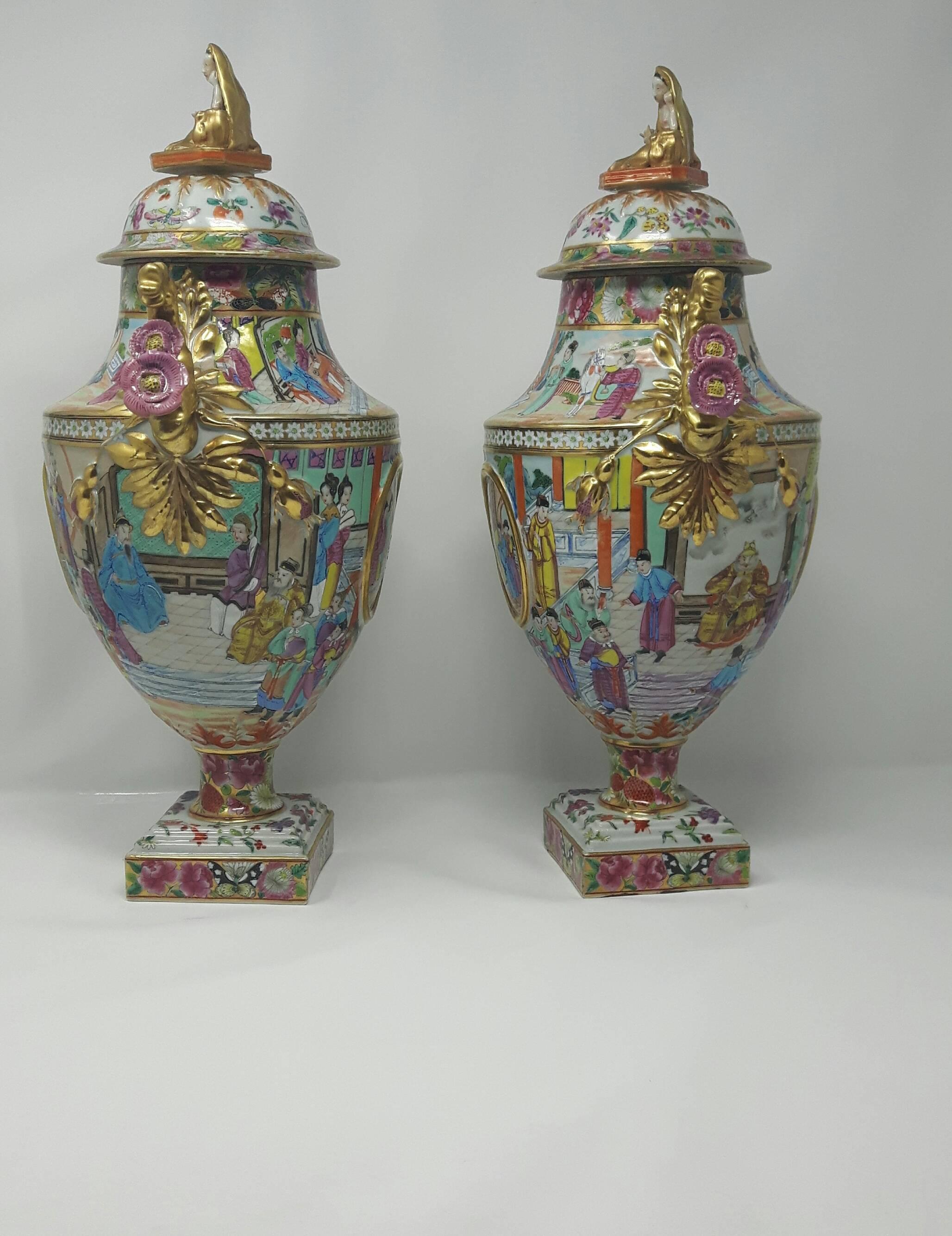 A rare pair of Chinese export European shaped porcelain vases plus covers cantonb enamel decorated.