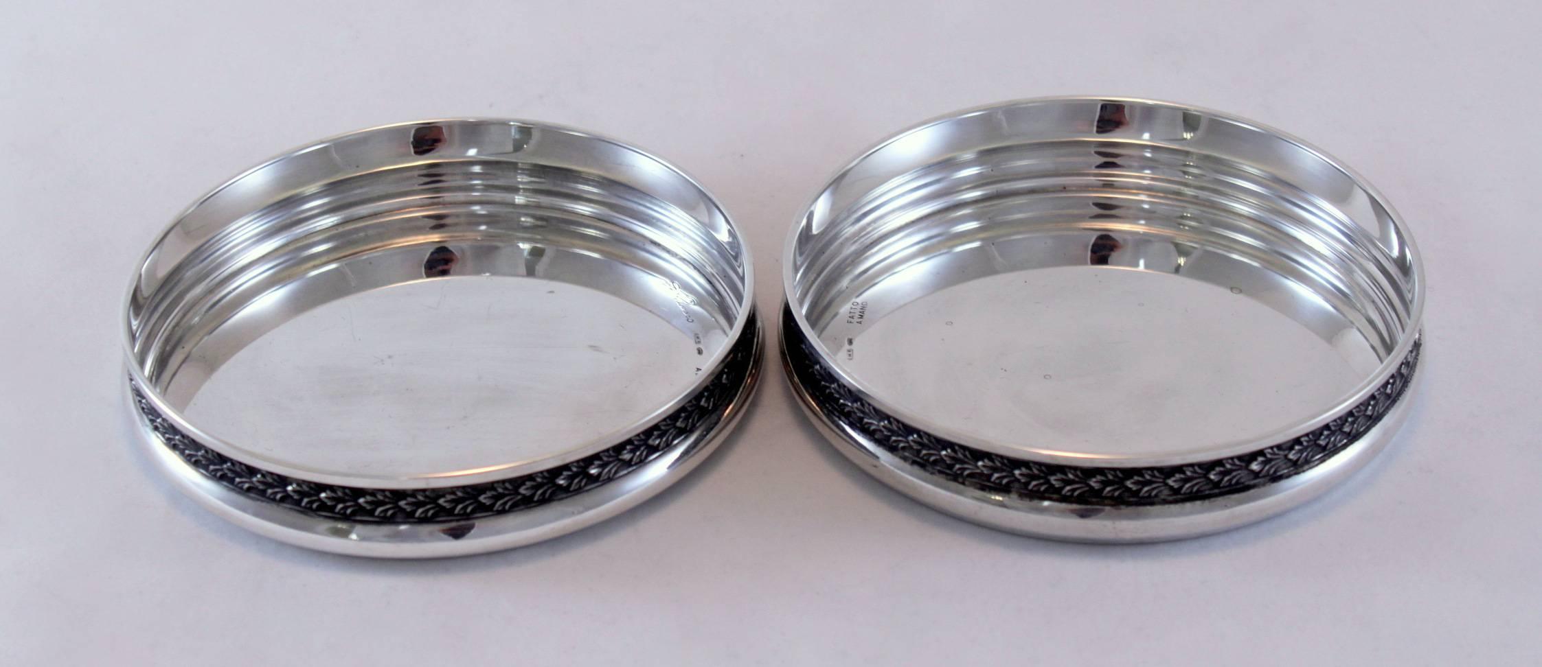 Pair of silver wine coasters
By Fatto Amano
Italy, circa 1900
800/1000
Fully hallmarked.

Approximate dimensions: 
Diameter x height 11.8 x 2.1 cm
Total weight: 206 grams

Condition: Minor wear and tear from general usage, some micro