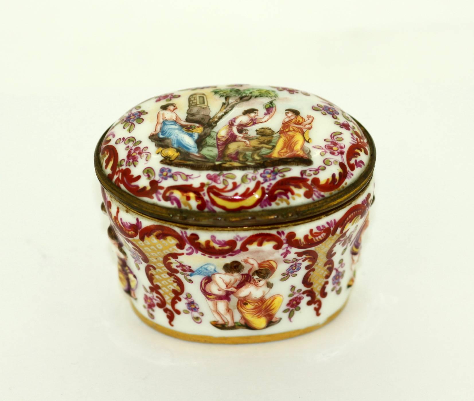 Antique Erotica Porcelain Jar With Lid, ornately decorated with gold and cherry red overlay and raised puttis figures in erotica scenery. The underside marking of the capital N under a four pronged crown and the country of Germany date these to