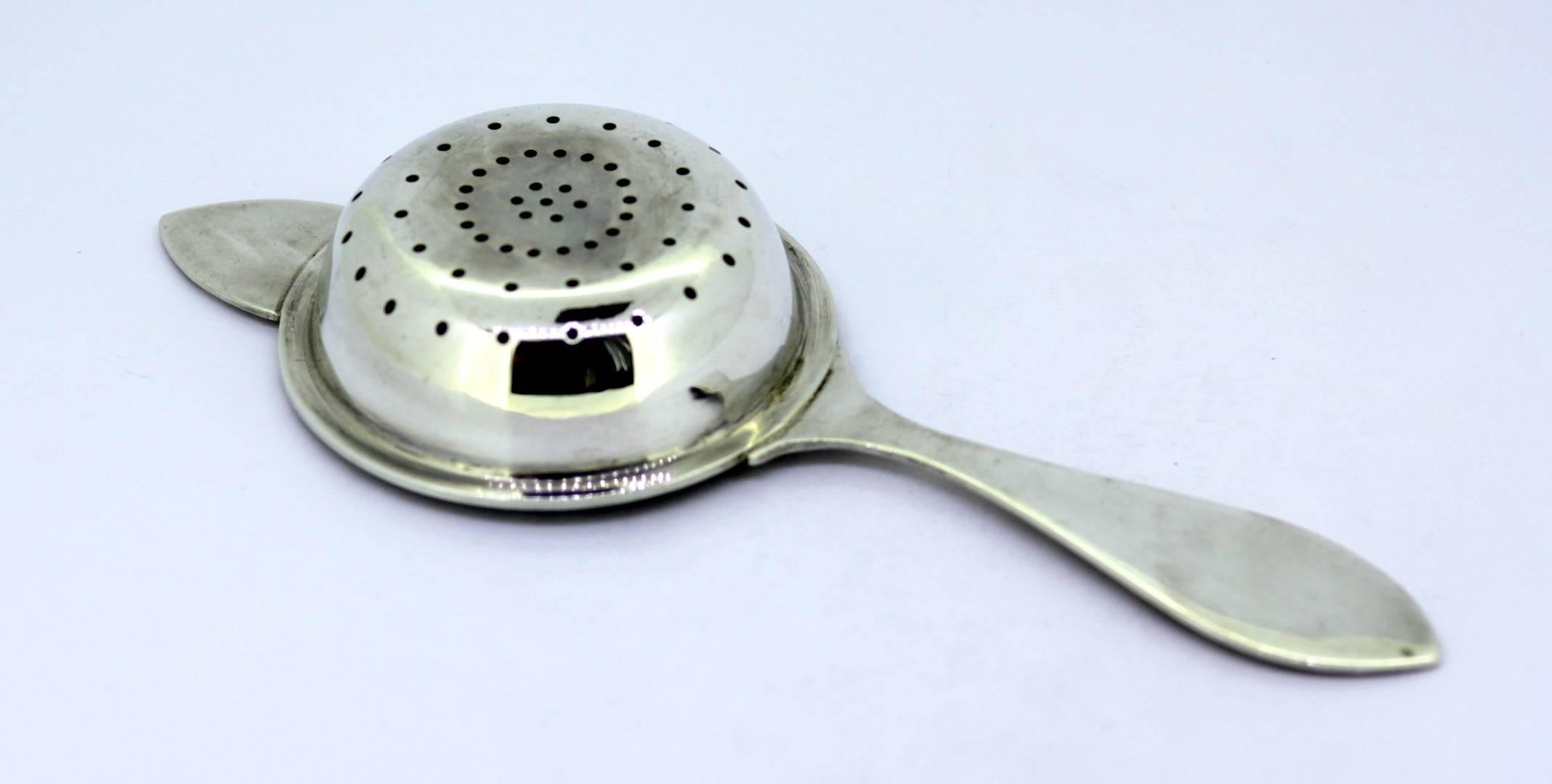 Sterling Silver Tea Strainer 
By Francis Howard Ltd 
Made in Sheffield 1942 
Fully hallmarked. 

Dimensions - 
Size : 16.3 x 6.25 x 2 cm 
Weight : 53 grams 

Condition : Surface wear and tear from general usage, overall great condition with no