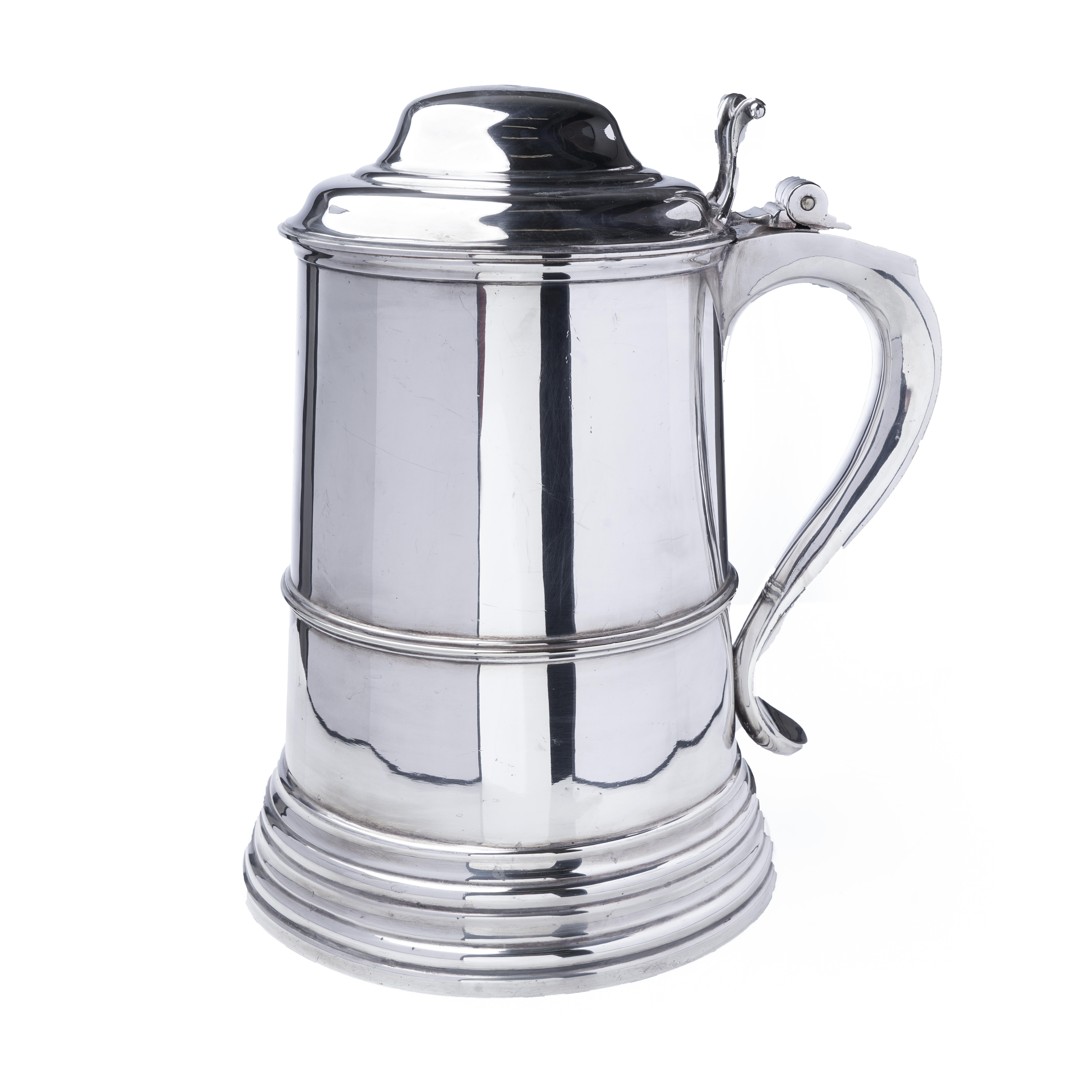 A substantial and finely crafted silver-plated lidded large tankard by Mappin & Webb, showcasing their renowned Princes Plate silverware line. The body features a stepped foot and central banded detail, complemented by a large curved handle and
