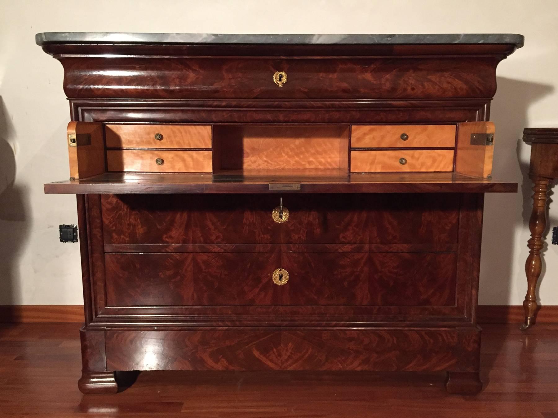 Beautiful walnut Louis Philippe commode. The second drawer folding down into a secretary writing desk with compartment for storage and organization.