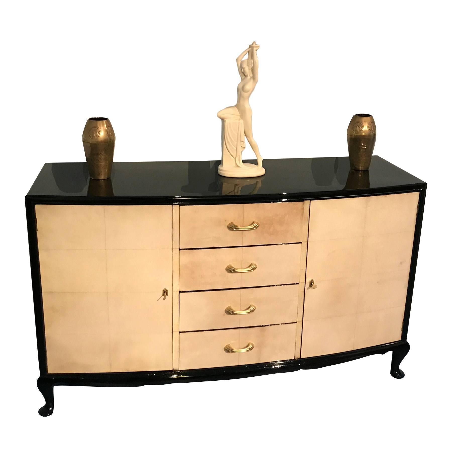 Elegant French Art Deco parchment sideboard manufactured in France in the 1950s.
Beautiful oriental line base, black lacquered side, top and legs.
Clear lines and a simple but stylish shape.
Completely restored.
