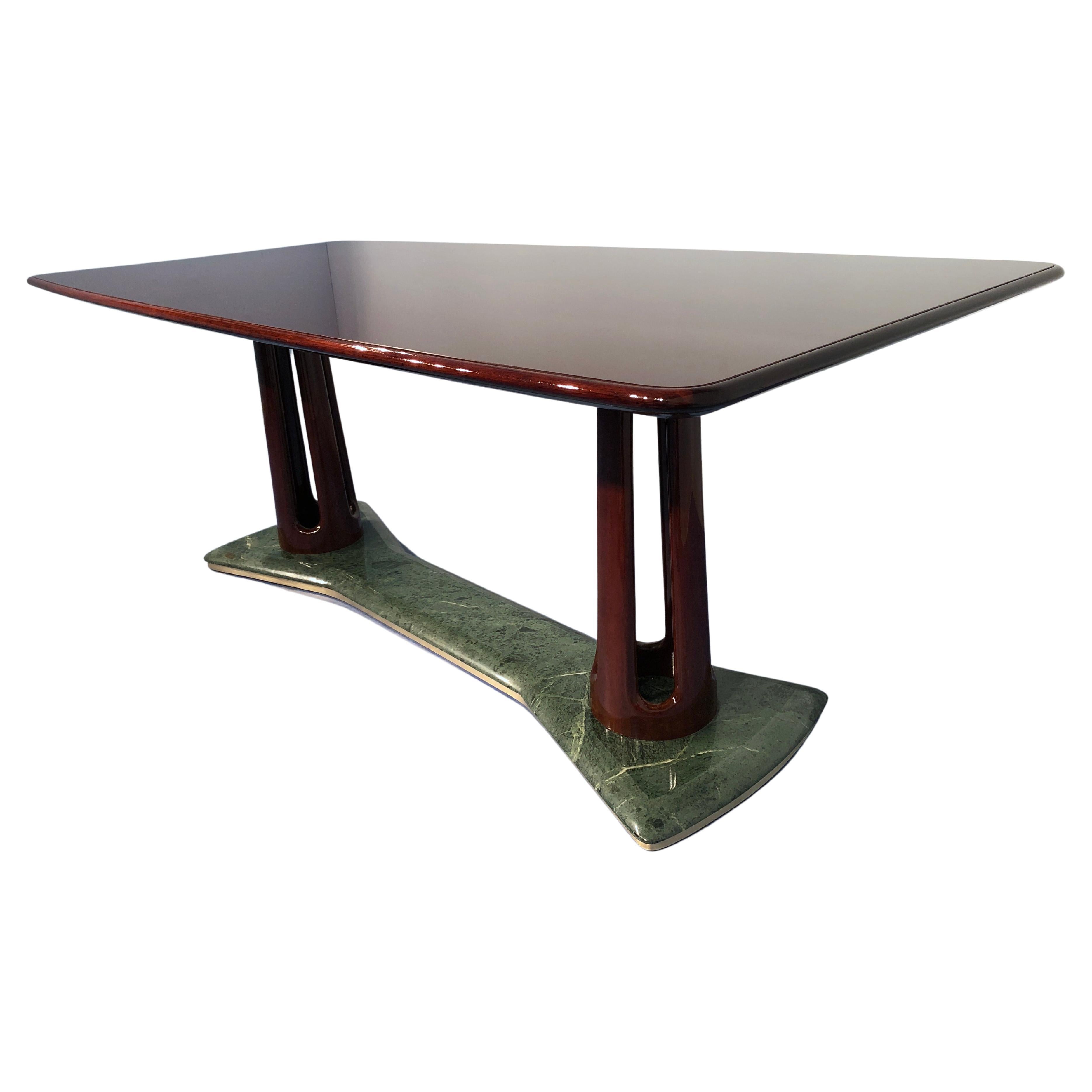 This masterpiece has been manufactured by Vittorio Dassi in 1950 and is a magnificent example of the Italian design of the period. It composed of precious mahogany wood, fine colored glass on the top, and Dolomiti Green Alps marble banded with