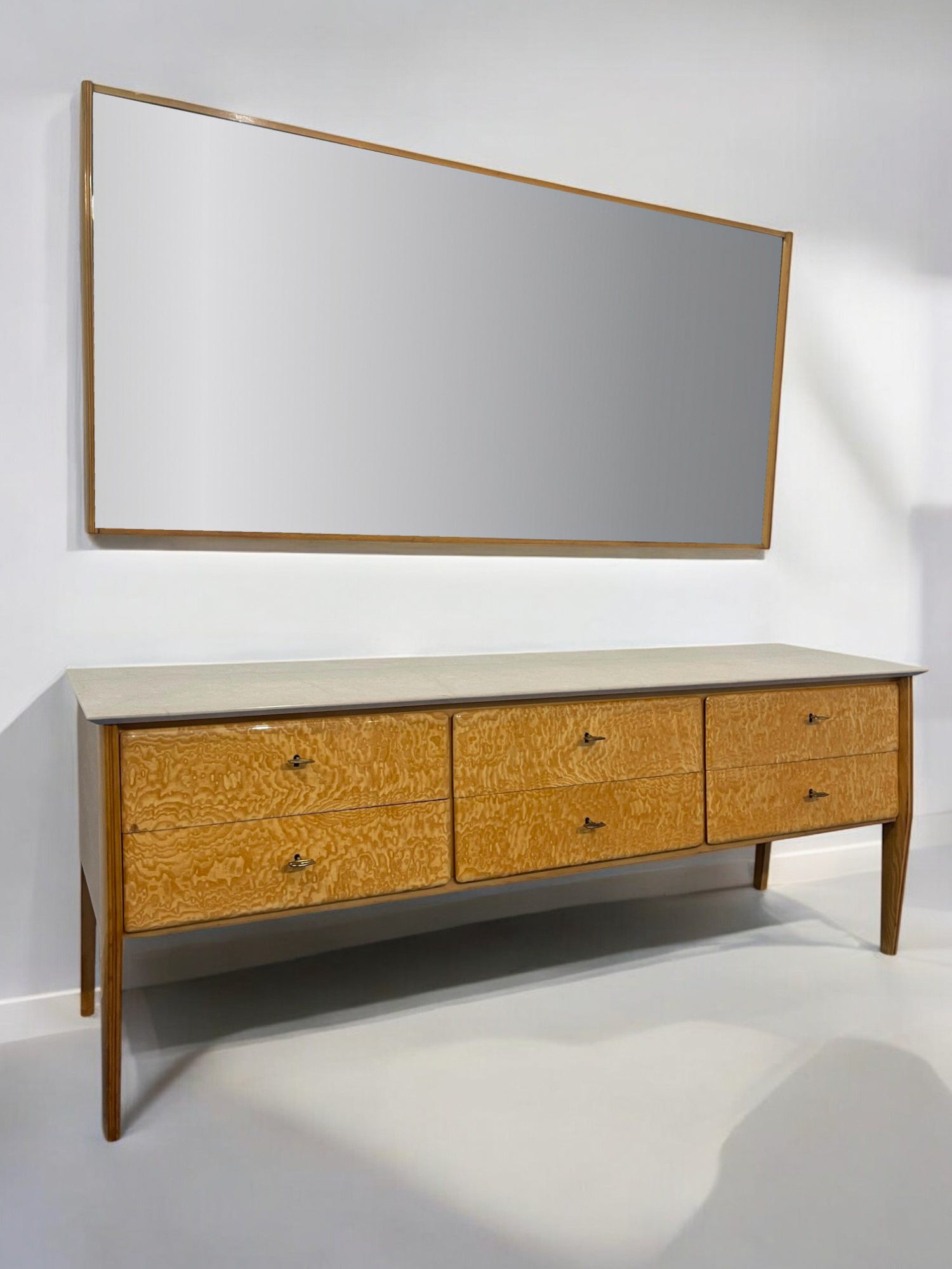 Dresser designed attributed to Giò Ponti, Italy, 1950s, whose refined design is enhanced by the beautiful white ash veneer. The top is made of precious Botticino marble, featuring beveled edges on the inside. It includes six spacious drawers,
