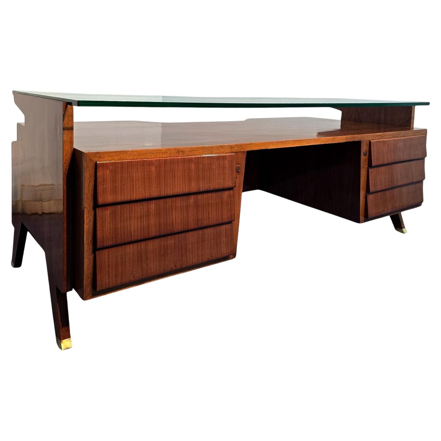 Majestic Italian Midcentury Presidential Desk designed by Vittorio Dassi in 1950s, givenits large and rare dimensions , can be assumed that it was designed on special commission, the presence of a double bottom in a drawer, something very rare for