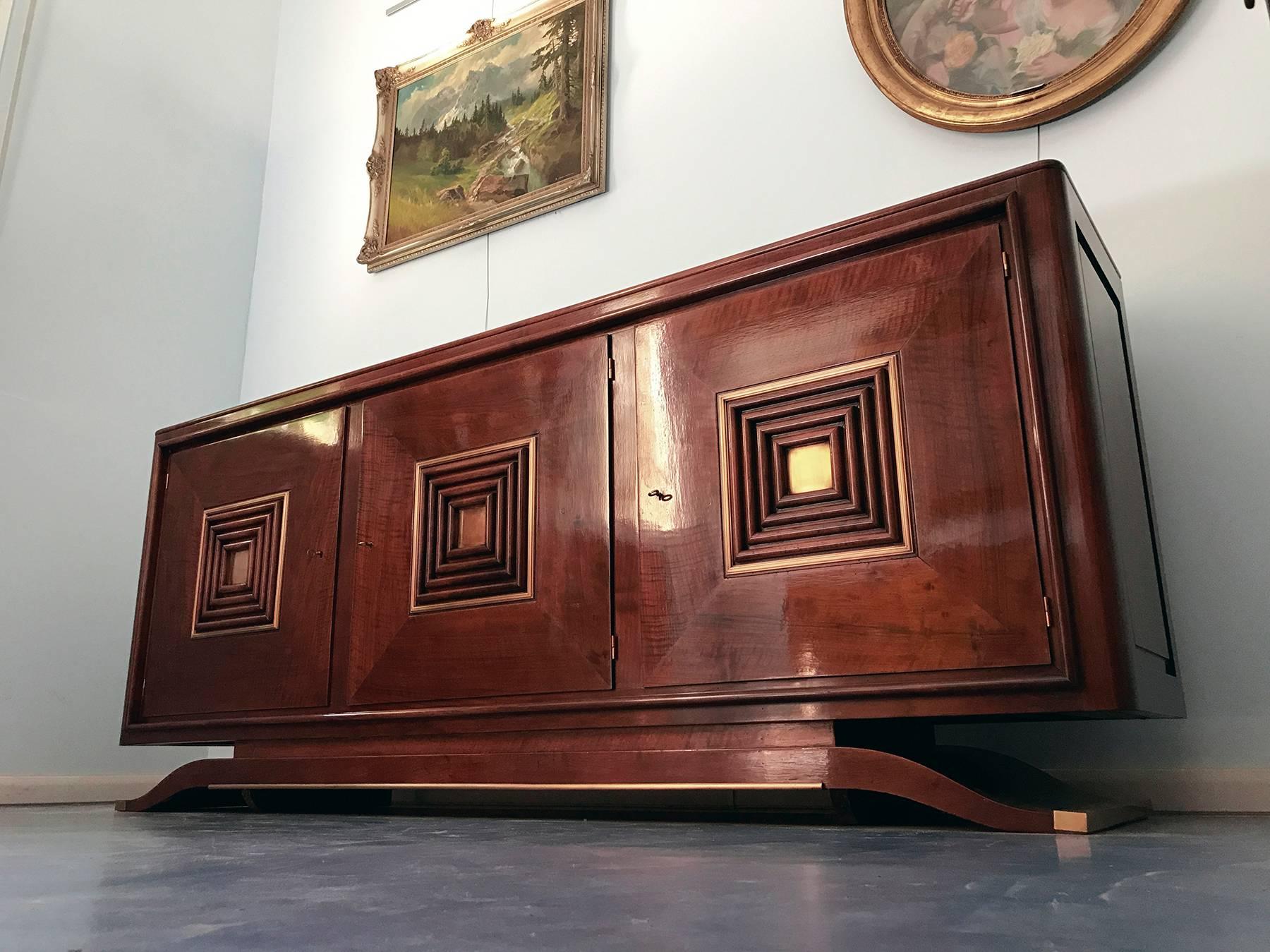 Splendid French Art Deco walnut sideboard in the style of Maxime Old.
Beautiful doors with rationalist motifs, fine bronze garniture and superb Portor marble top.
Ready to use, recently restored.