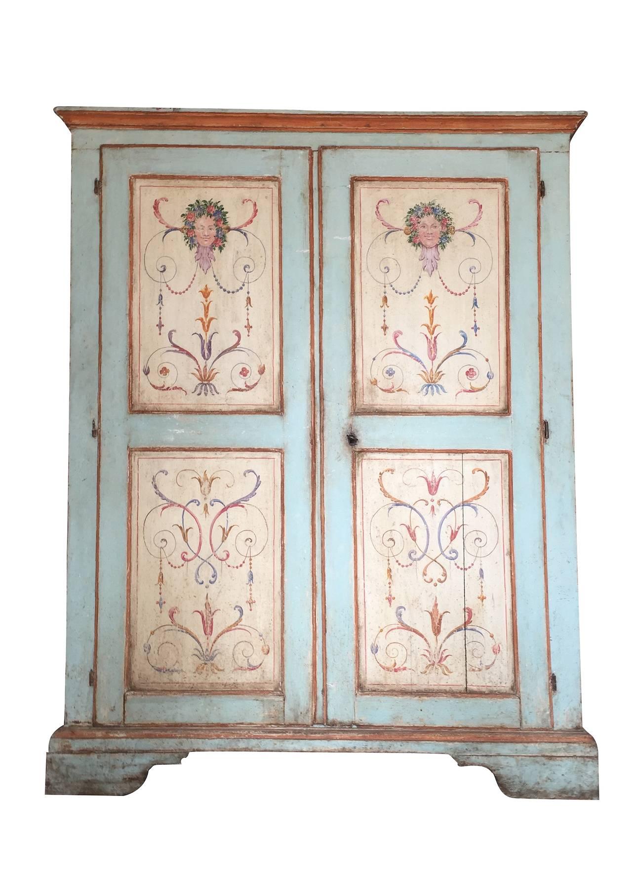Beautiful painted 18th century Italian wardrobe, superior panels door decorated with typical 