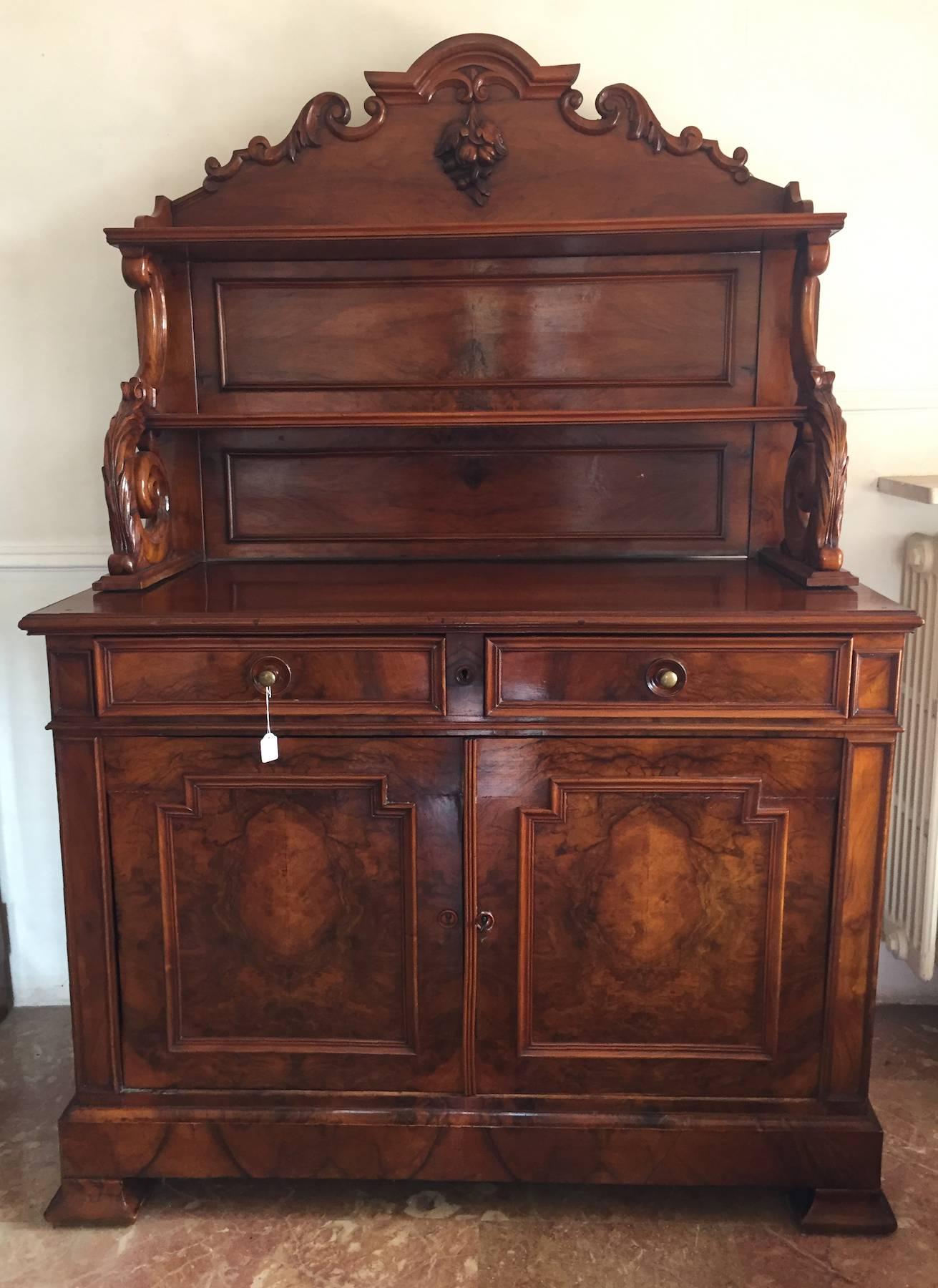 19th century French sideboard, beautiful carved top section support, nice radica walnut on the front.
The piece is in excellent condition and would be a beautiful addition to dining room or living room.