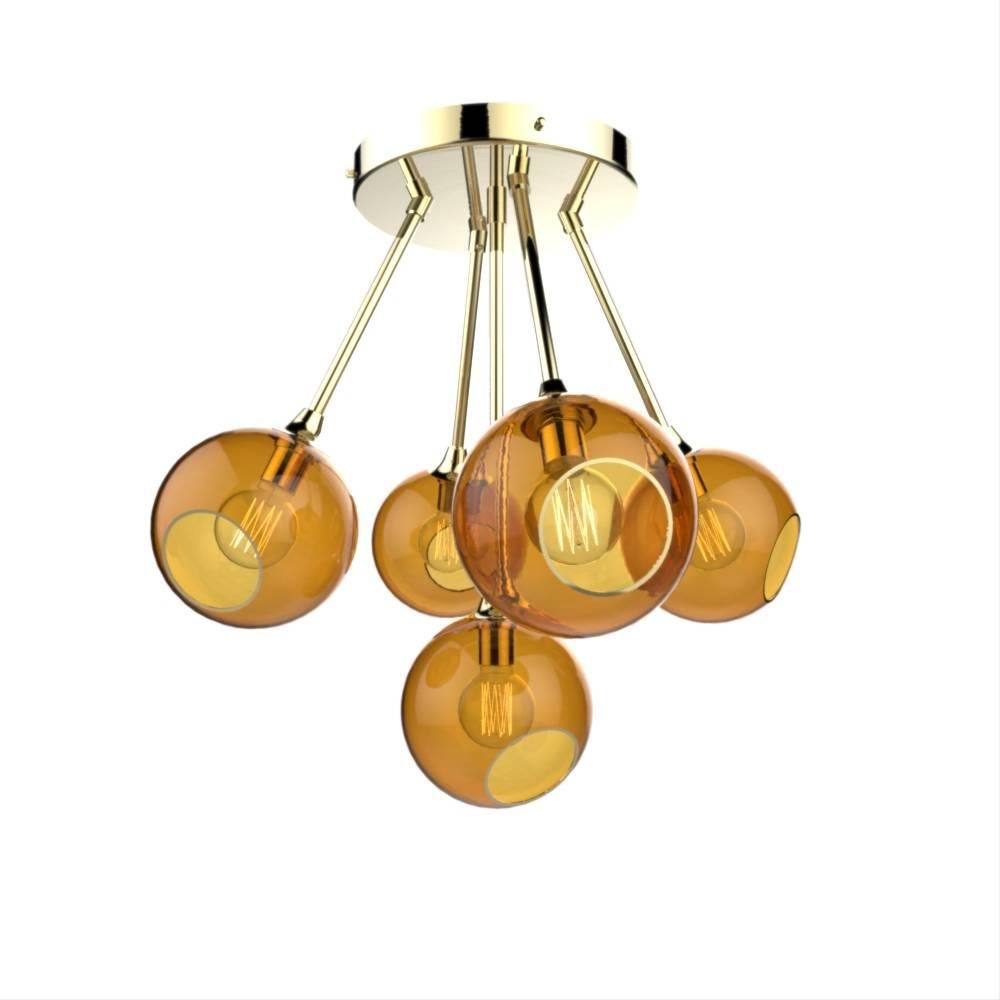 Danish design from Design by Us

The ballroom molecule chandelier features five spheres, available in different translucent hues, they merge in a unique atom shape to form a dazzling molecule!

Mouth blown and hand-painted glass with brass