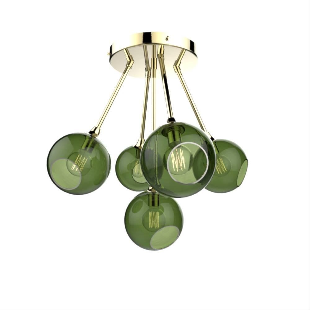 Danish design from Design by Us

The ballroom molecule chandelier features five spheres, available in different translucent hues, they merge in a unique atom shape to form a dazzling molecule!  

Mouth blown and hand-painted glass with brass