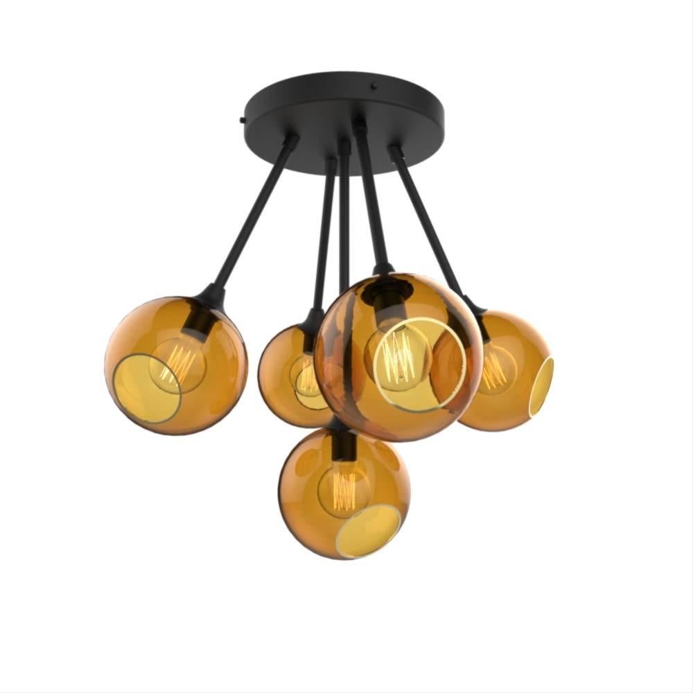 Danish design from Design by Us

The Ballroom Molecule chandelier features five spheres, available in different translucent hues, they merge in a unique atom shape to form a dazzling molecule!  

Mouth blown and hand-painted glass with brass hand