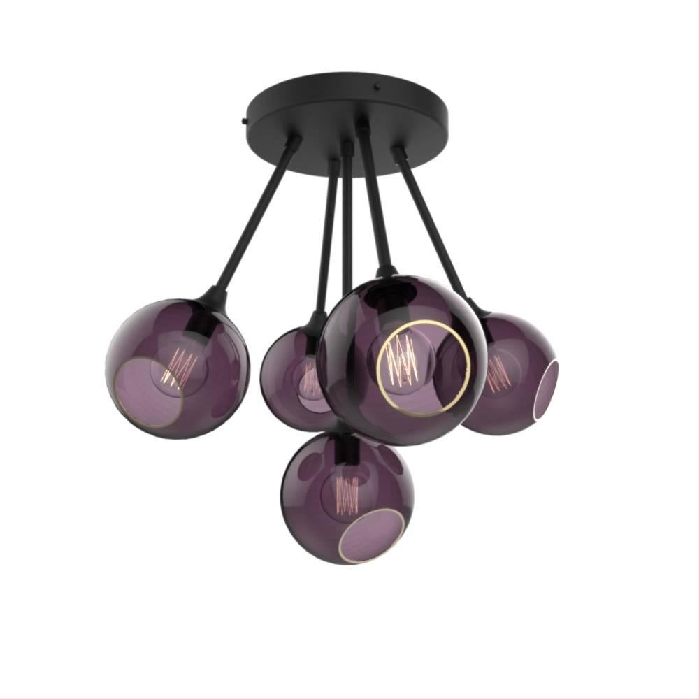 Danish design from Design by Us

The Ballroom Molecule chandelier features five spheres, available in different translucent hues, they merge in a unique atom shape to form a dazzling molecule!  

Mouth blown and hand-painted glass with brass hand