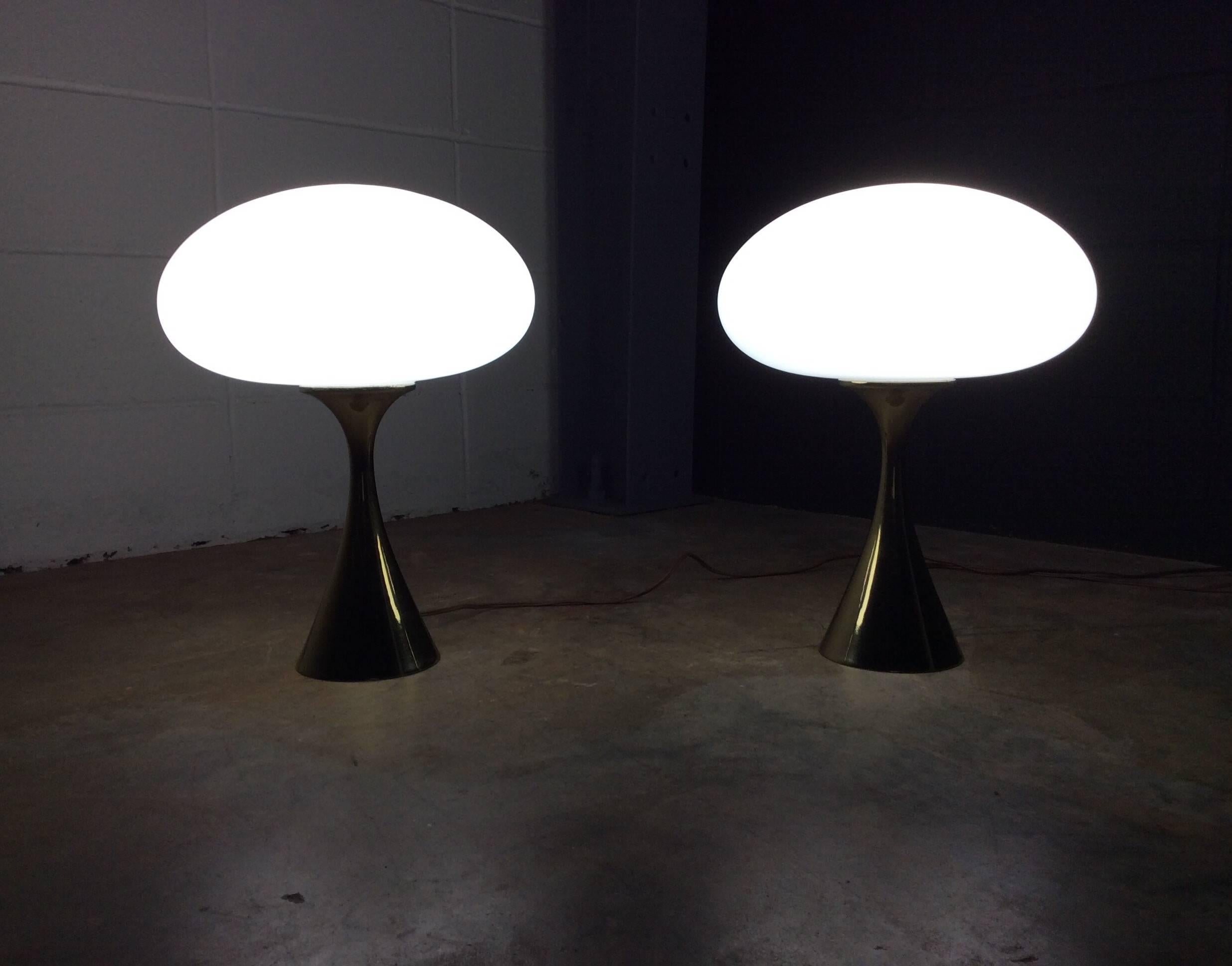 Stunning pair of Mushroom Laurel Lamps designed by Bill Curry. The lamps feature hand blown Italian glass shades resting on classic brass tulip style bases. They retain their original wiring and are 100% working order. 

There are no known defects