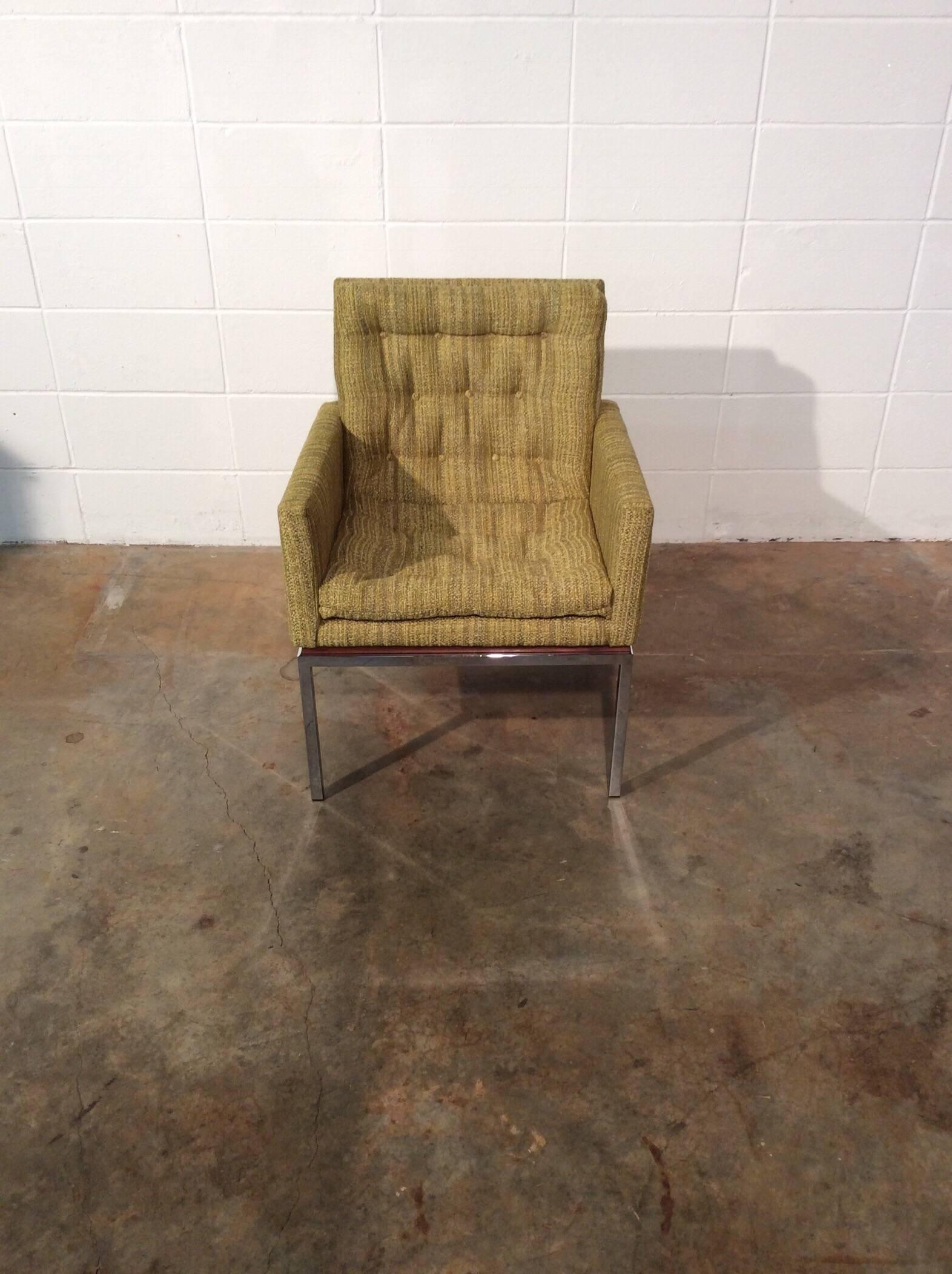 Restored Mid-Century Modern chair on chrome and walnut base by Drexel.
Completely restored cube chair upholstered in a green and multicolor fabric resting on a chrome base.
Restoration includes new foam, new fabric, refinished Walnut spacer, and