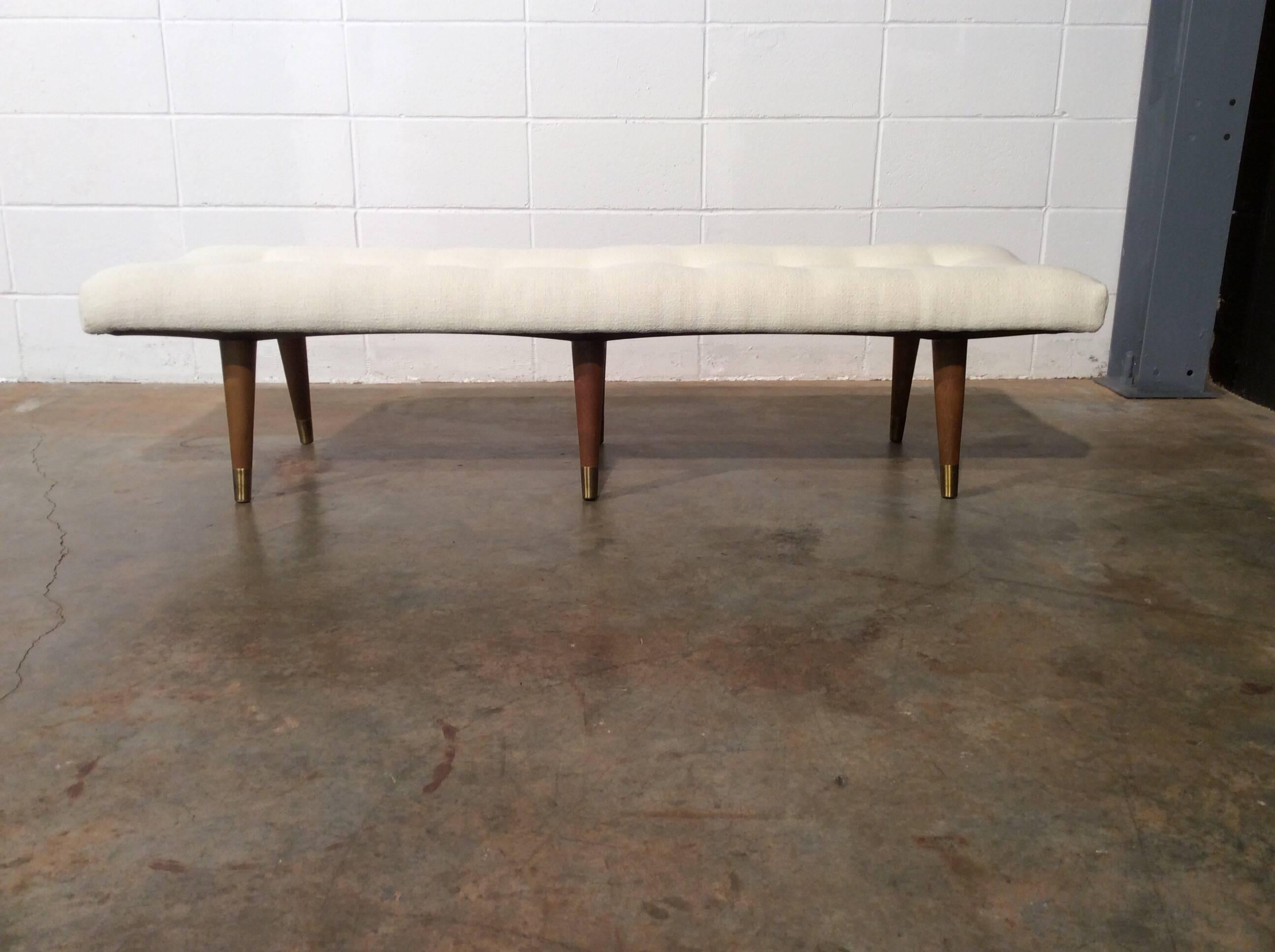 Unique Mid-Century Modern bench with an unusual six legs and a contoured seat for maximum comfort. This bench has been fully restored including new foam, new fabric, and refinished legs.