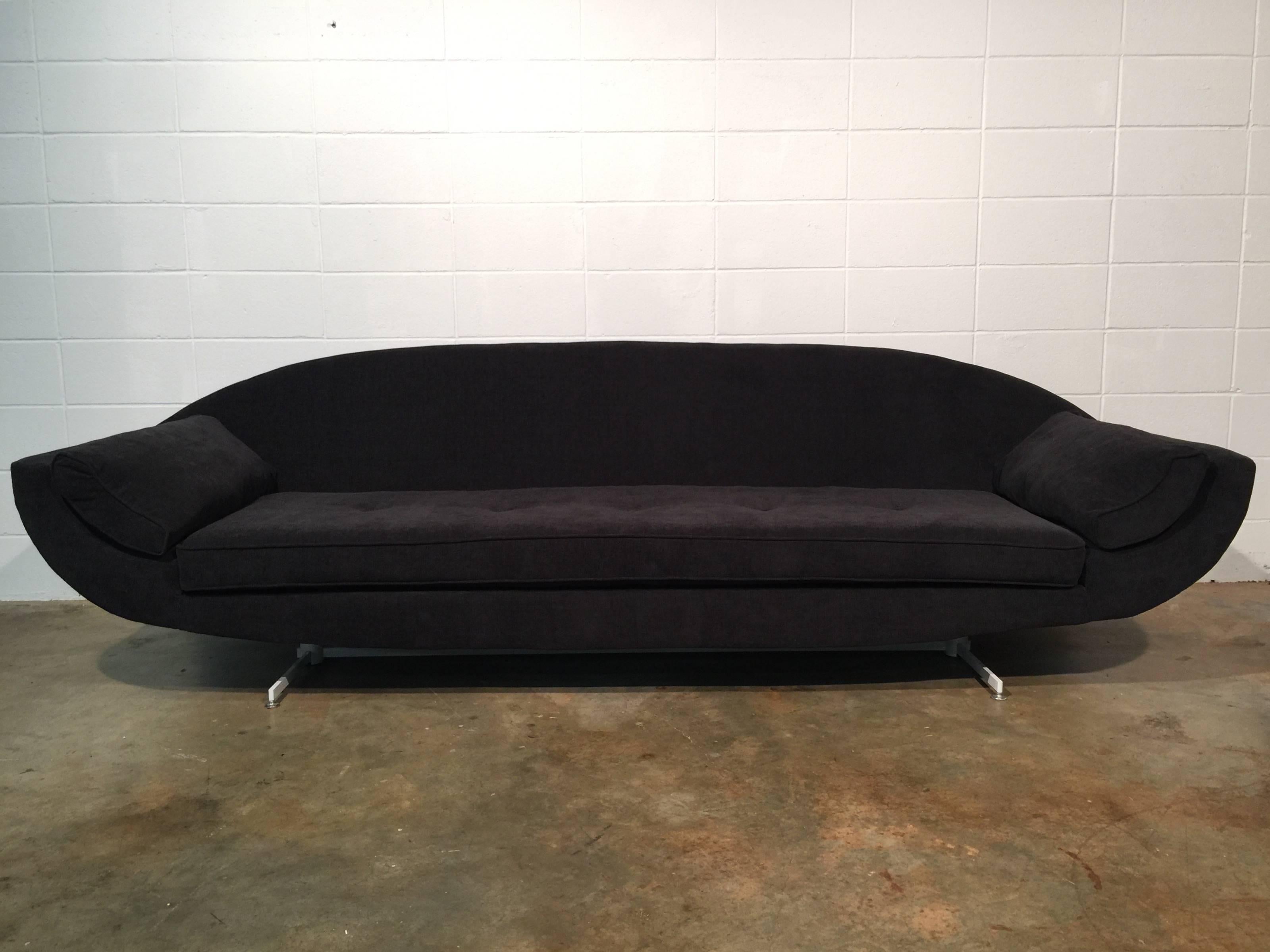 Restored Mid-Century Modern Gondola sofa with a unique metal base. This sofa has been restored from top to bottom. Restoration includes all new foam, new black chenille fabric, a freshly lacquered base, and four down filled accent pillows. This sofa