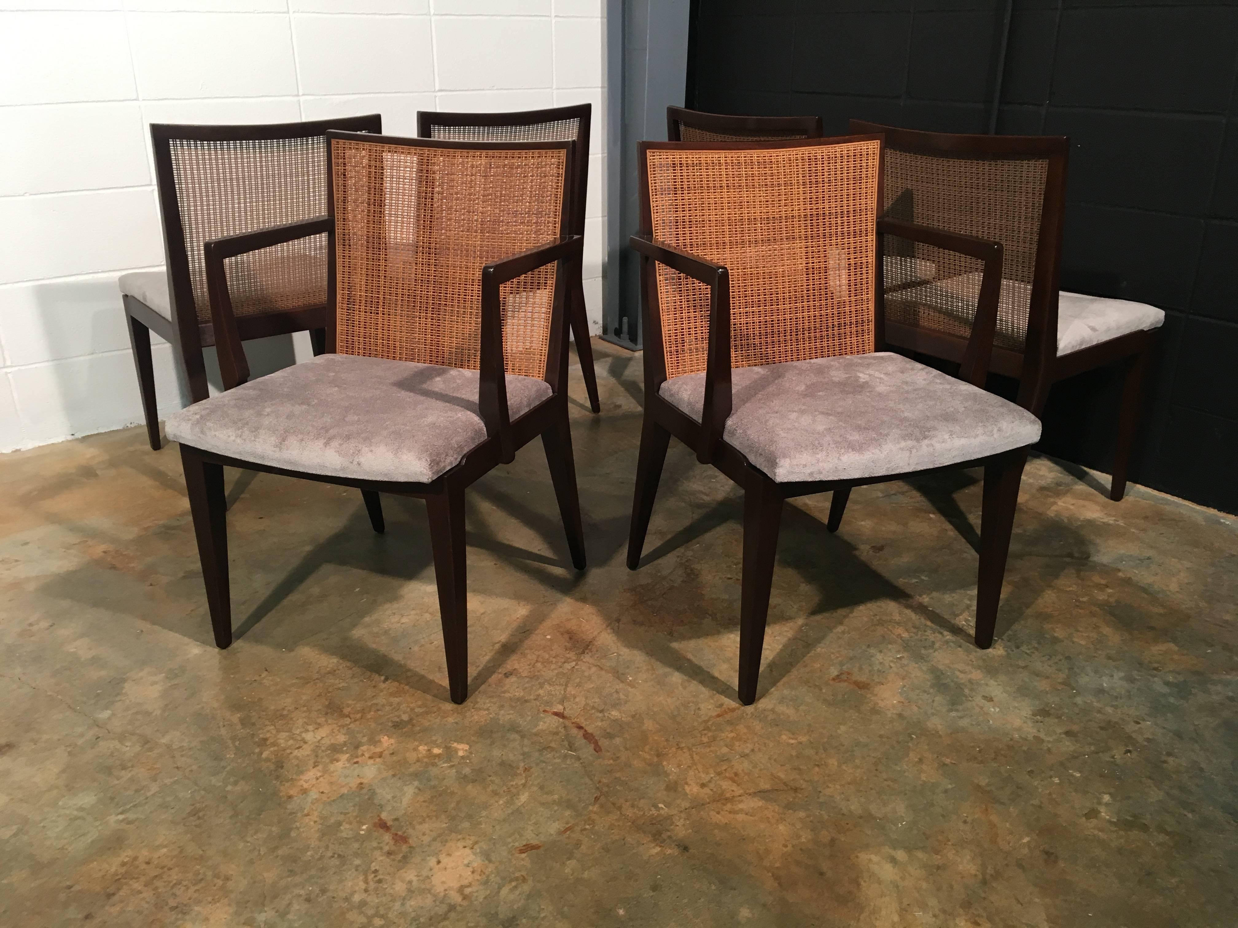 Set of six dining chairs designed by Edward J Wormley for Dunbar. Included is four Model No. 5953 (side chairs) and two Model No. 5954 (armchairs). The chairs have new foam and new fabric but are completely original otherwise. The wood and the