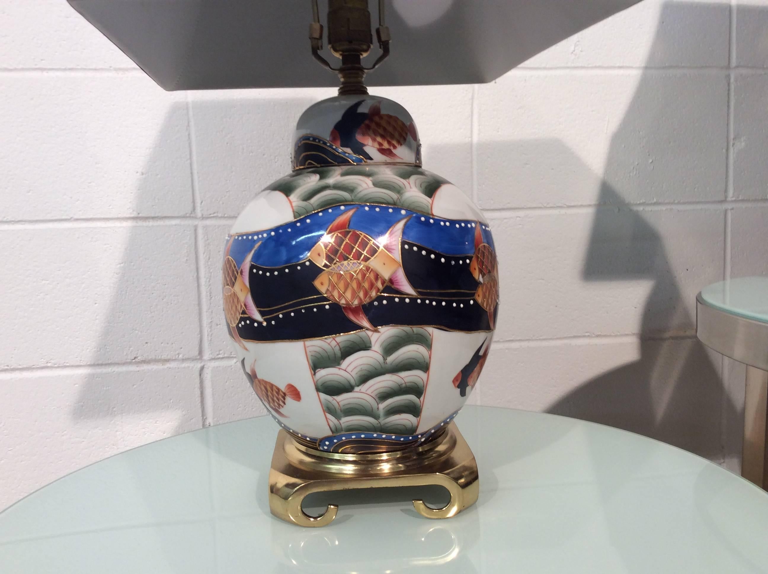 Excellent pair of Asian lamps featuring hand-painted Koi fish. Very bold and vivid in color. The wiring and sockets and are safe and in perfect working order. About 1/2