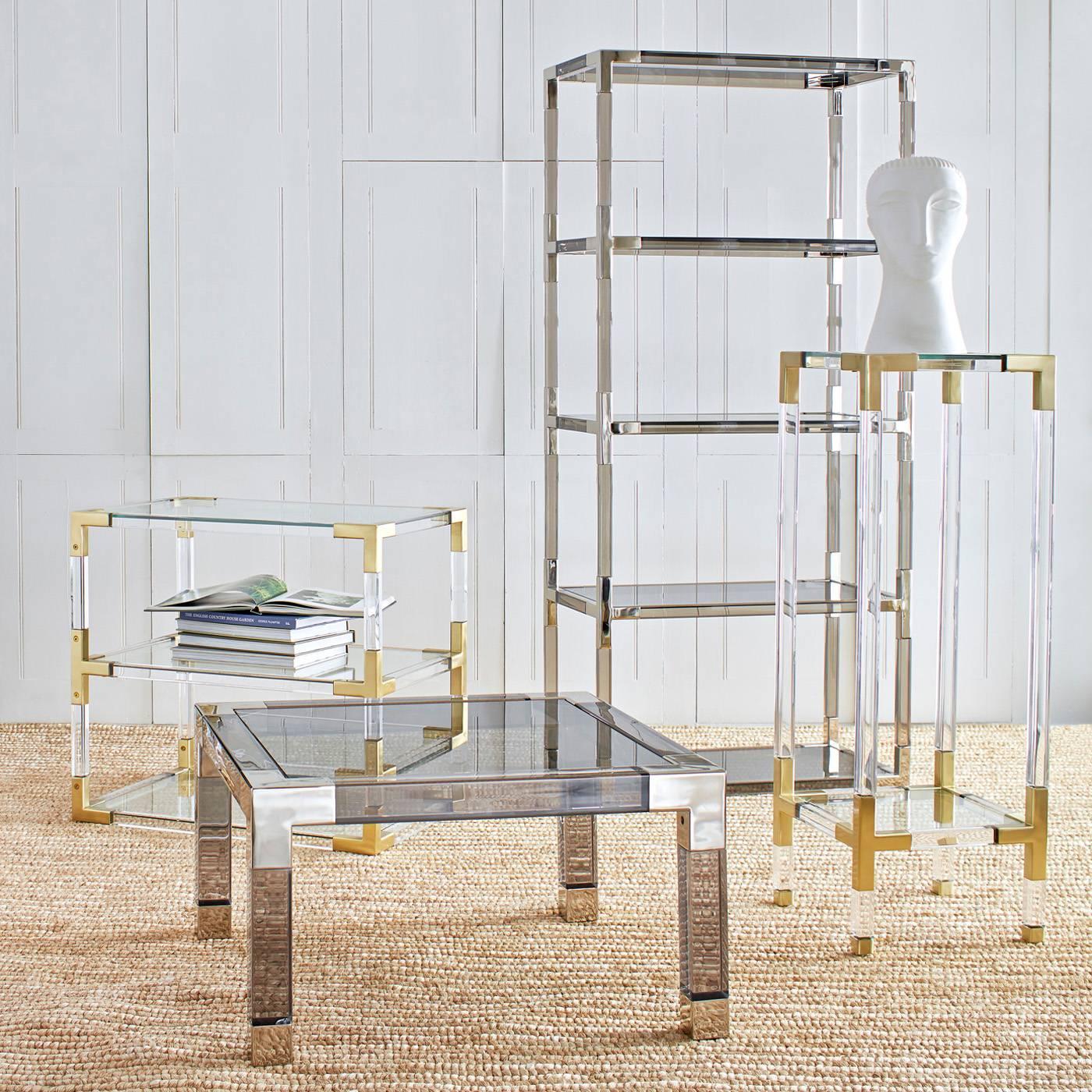 Clearly cool. Our Jacques collection is the perfect blend of simplicity and glamour, modern and traditional. Shown in moody smoke Lucite and nickel. Also available in crystal clear Lucite with brushed brass corners. Fab for books or for displaying