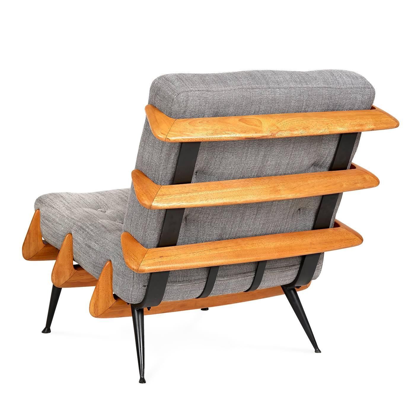 A new classic. With nods to the structure of Japanese pagodas and Scandinavian Craft, our St. Germain lounge chair is perfectly pitched and incredibly comfortable. The blackened iron frame supports honeyed wood ribs that cradle soft,