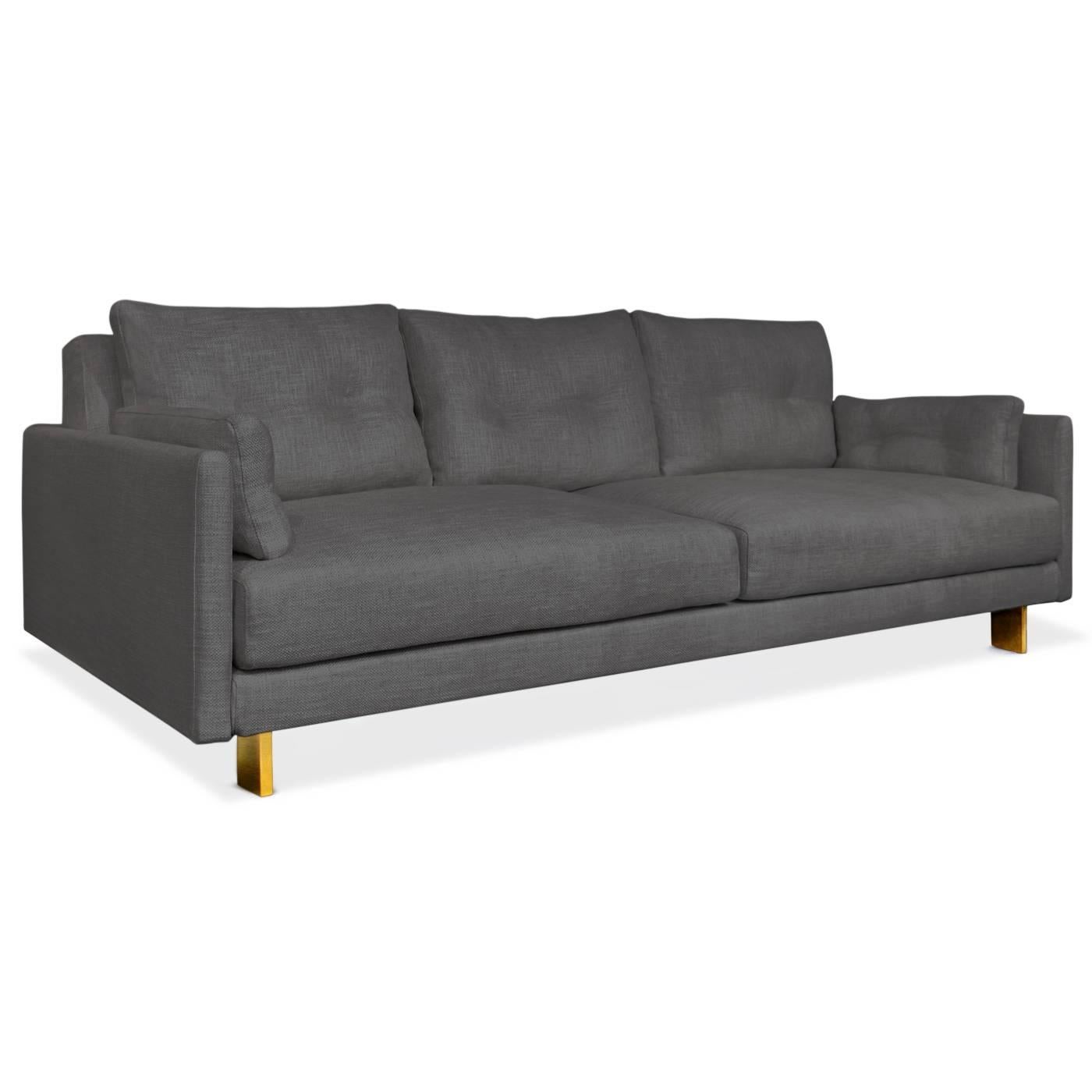 California modern. Deep and squishy, family-friendly, and très chic you can have it all. Upholstered in Mulholland Granite bouclé with minimal brushed brass legs. Combine details like inviting pin-tucked back and side cushions, with (surprise!)