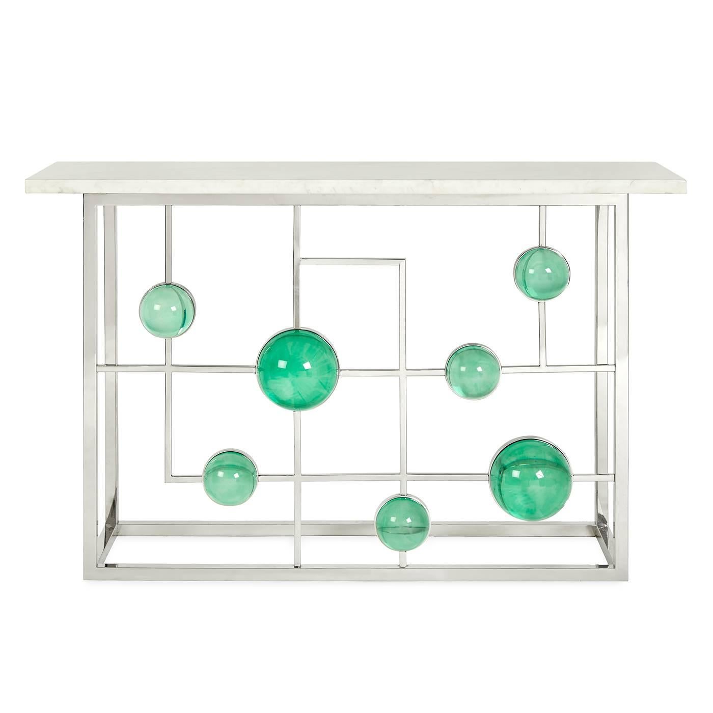 Futuristic elegance. A polished nickel fretwork cradles a constellation of emerald Lucite cabochons. Topped with a generous slab of Carrara marble, our Globo fretwork console is petite but powerful, like a glamorous cocktail ring. Fab in a foyer or