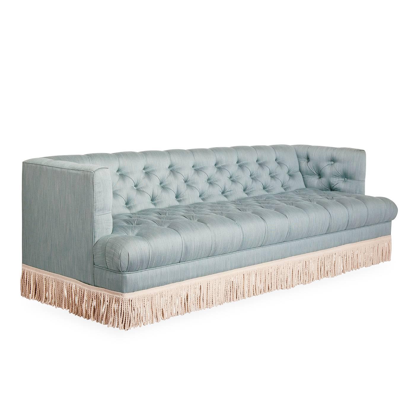 Clubby comfort. The Baxter T-arm sofa melds tufted comfort and clean lines. The cutback T-arm shape is magic—it balances the formality of a high-back tuxedo sofa with the invitingness of a more casual, less-closed in low-armed sofa. Très luxe in a