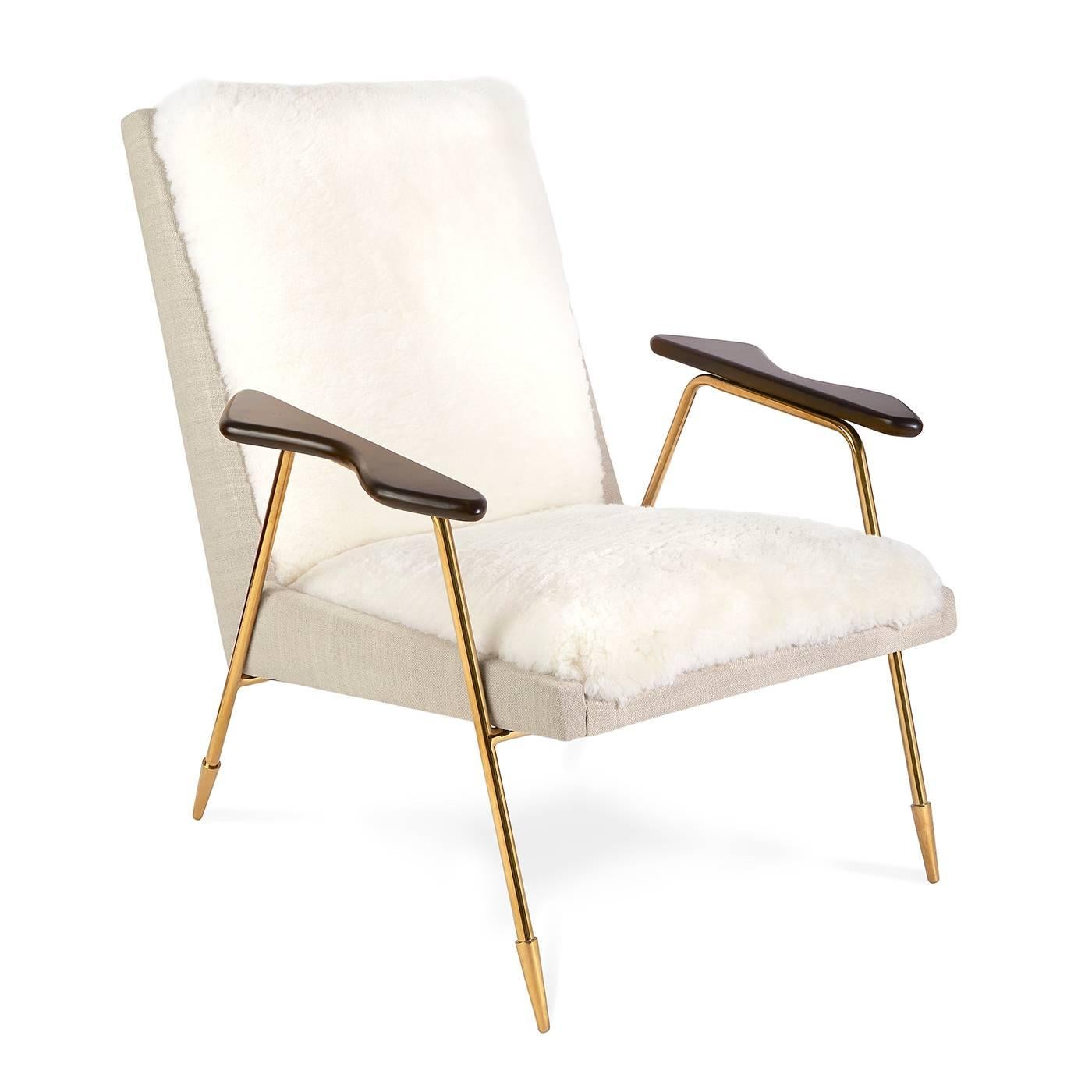 Scandi-Mod with an Italian flair. A delicious fusion of form and function. Features sculpted arm rests, natural linen sides and back, an exposed brass frame, and a shearling-lined seat for everyday luxe that's elemental to your décor. Signature