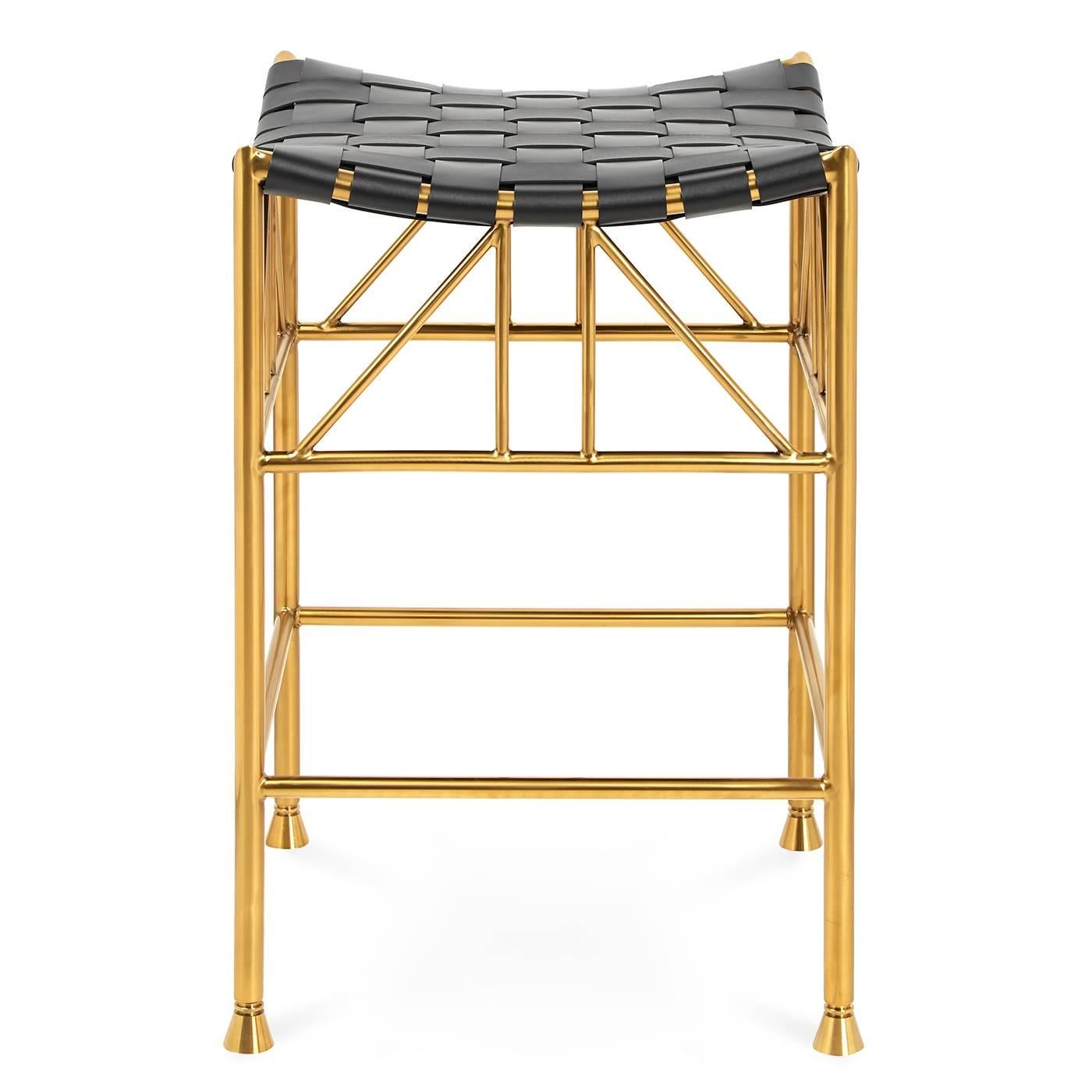 Royal seat. Thebes stools date back to the reign of the pharaohs and were revived by Liberty of London in the 19th century (when they rocketed to decorator staple status). Our modern interpretation features a brass framework and a spacious seat