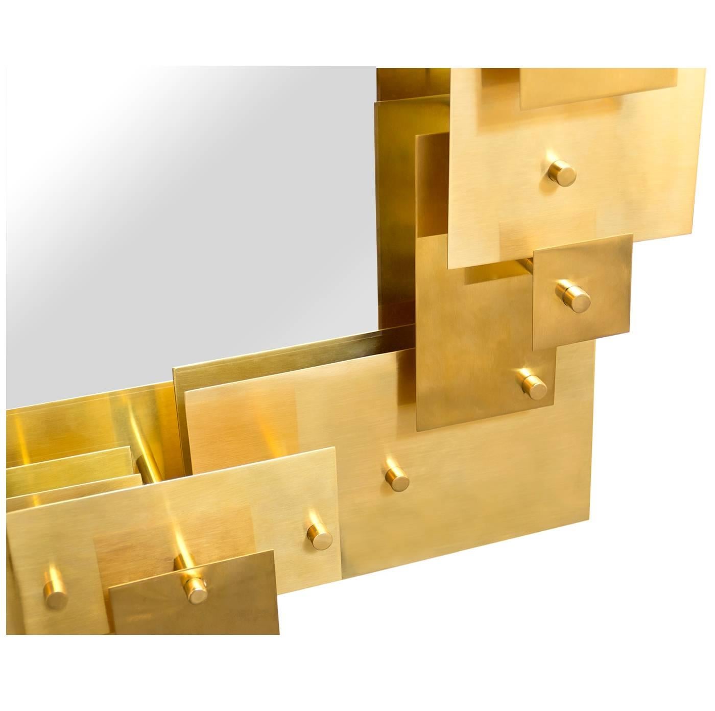Architectural Modernism. Inspired by a house of cards, our Puzzle Mirror is made of sheets of solid brass layered in a dynamic composition. Add intrigue to your foyer, bring moody glamour to your powder room, or bestow major majesty on your mantle.