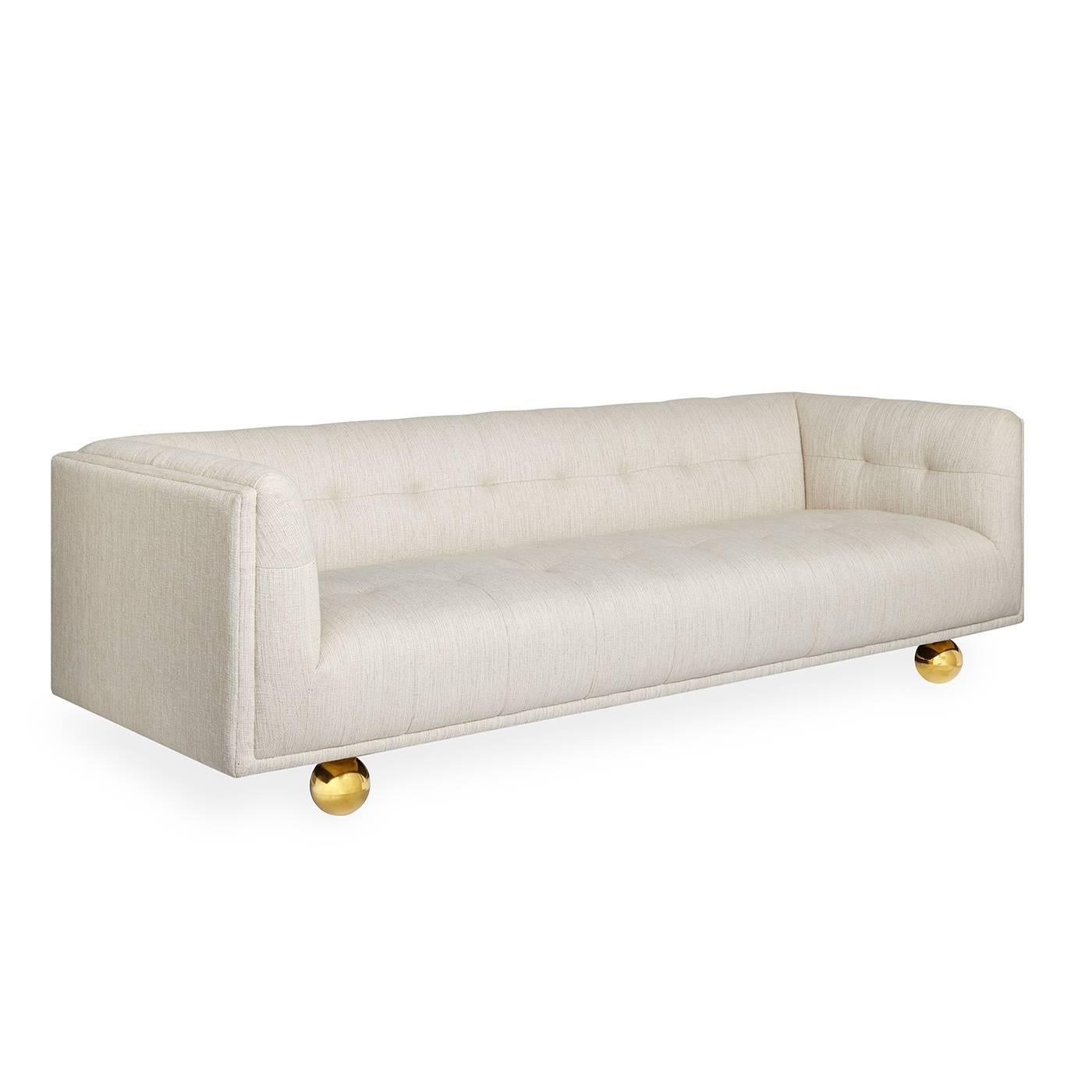 The Chesterfield sofa gets a Modern American Glamour update. We took the guts of a Chesterfield (clubby comfort and tailored tufting) and encased them in a pared down Silhouette. The finishing touch: we perched the haute hybrid on oversized brass