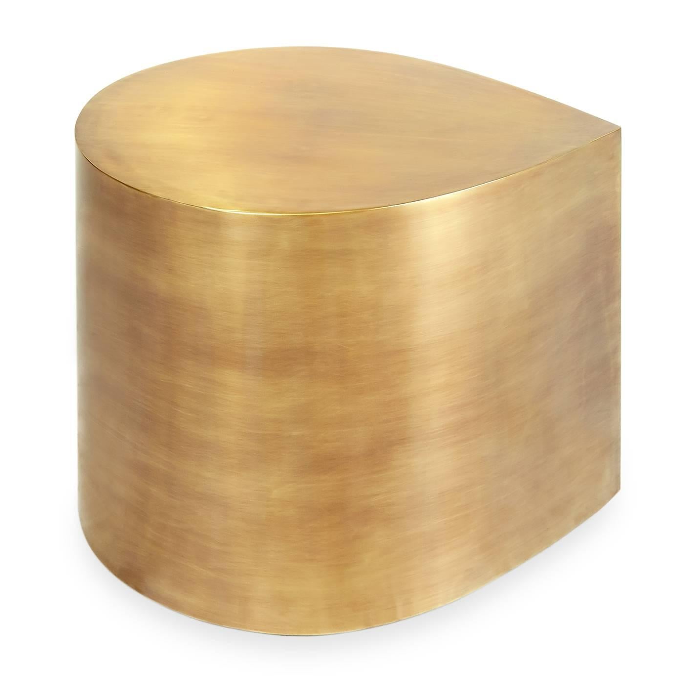 Side piece. Ideal for glam urbanites. A bold gesture with a bite-sized footprint, the brass teardrop table is perfect for apartment living. Use one alone as an end table, or group them together for a bold geometric cocktail table. Like a fine wine