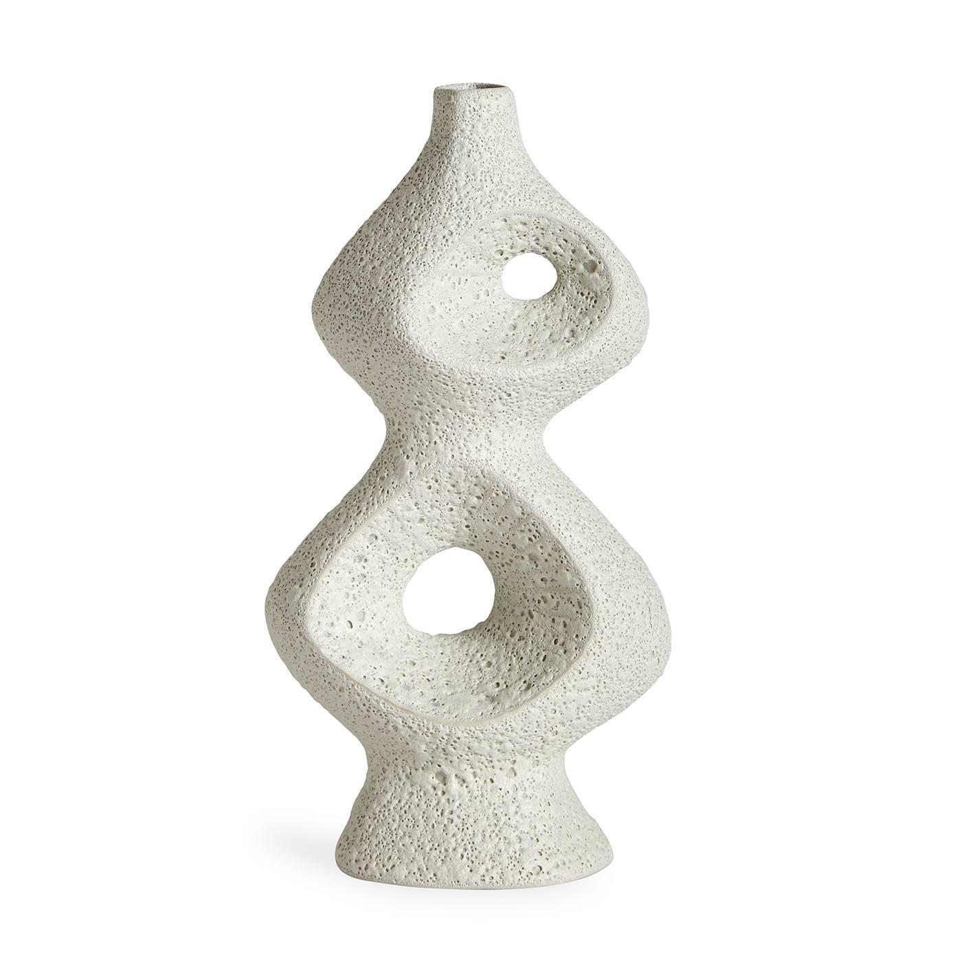 Softly sculptural. Inspired by the soaring organic modernist architecture of Le Corbusier's Ronchamp chapel, these vases feature soft curves accentuated with a deep and bubbly, white lava glaze. They're intriguing at every angle. Our Ronchamp Claude