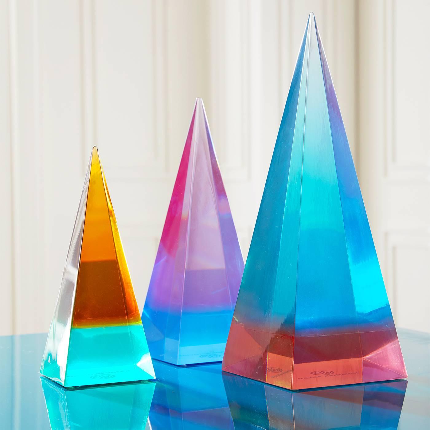 Color Theory. Explore the trippy optical majesty of Lucite. Our pared down obelisks are crafted from two tones of Lucite that visually meld to look different from every angle. Fab on a mantel or cocktail table, these obelisks add a perfect punch of