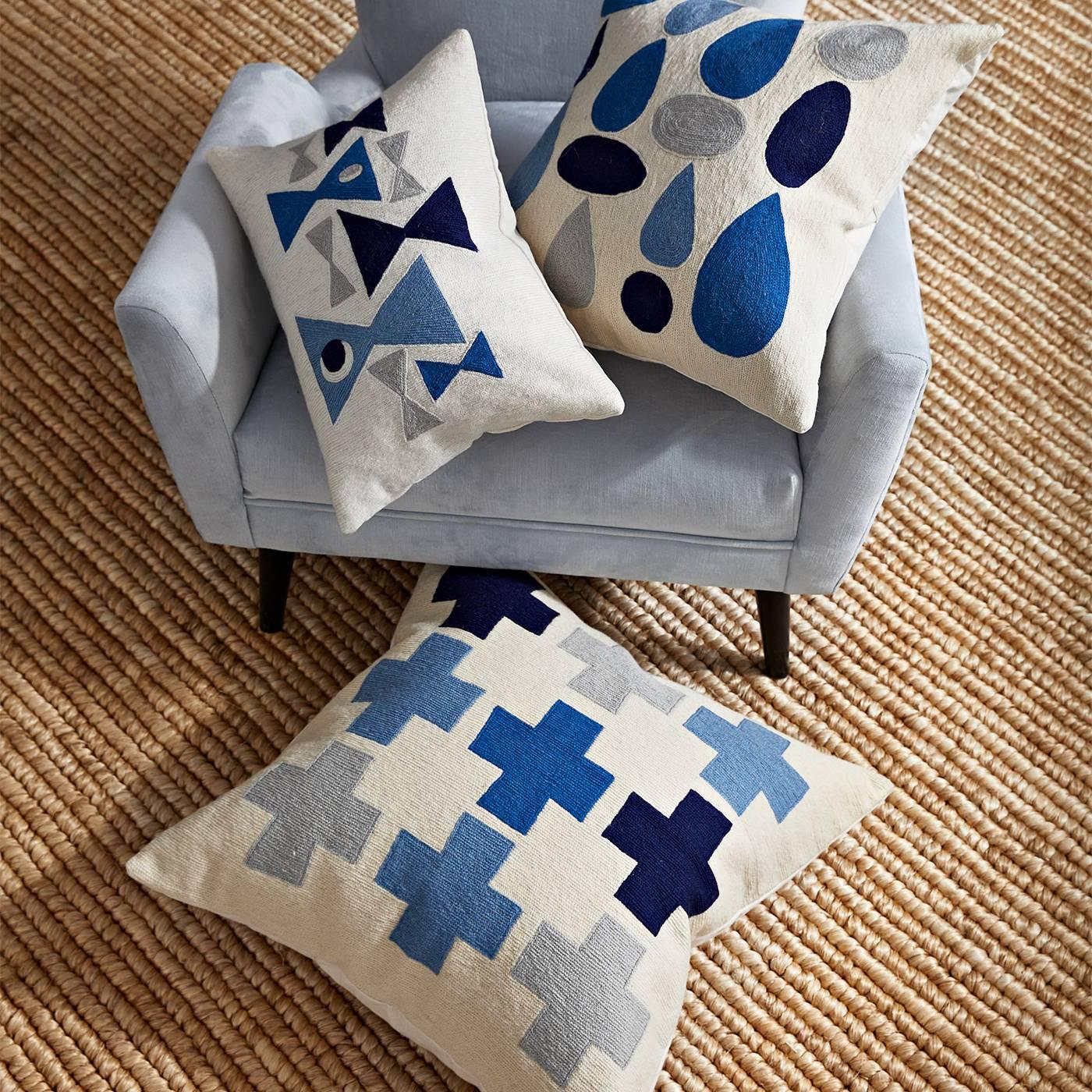 Couture crafts. Hand-stitched by artisans in Kashmir, our Geo chain stitch pillows balance rigorous craftsmanship with chic graphics. Each one is hand-embroidered in wool using a needlepoint chain-stitch technique. Mid-Century Modern patterns meet