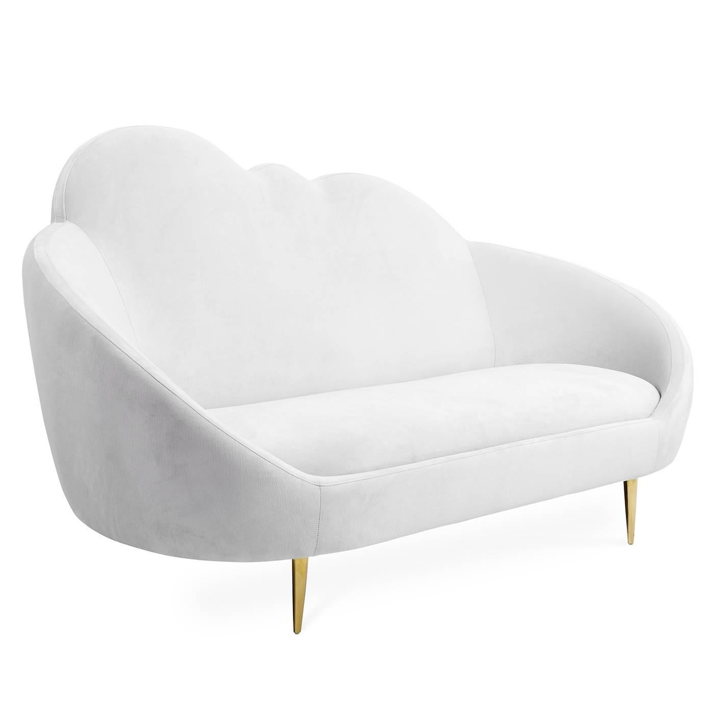 Heaven sent. Our Ether settee has a simple genesis story: JA wanted to create a settee that looks and feels like heaven. The chic cloud silhouette and lozenge-like form are enveloping and inviting, while gleaming brass stiletto legs project posh