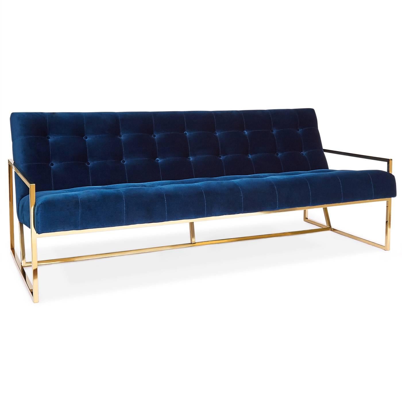 Minimalist Comfort. Pared down geometry in polished brass meets swanky navy velvet in our Goldfinger Apartment sofa. A little bit 1970s, a lot today. Goldfinger is the winning ticket that adds Modernist rigor to your Park Ave pad or swanks up your