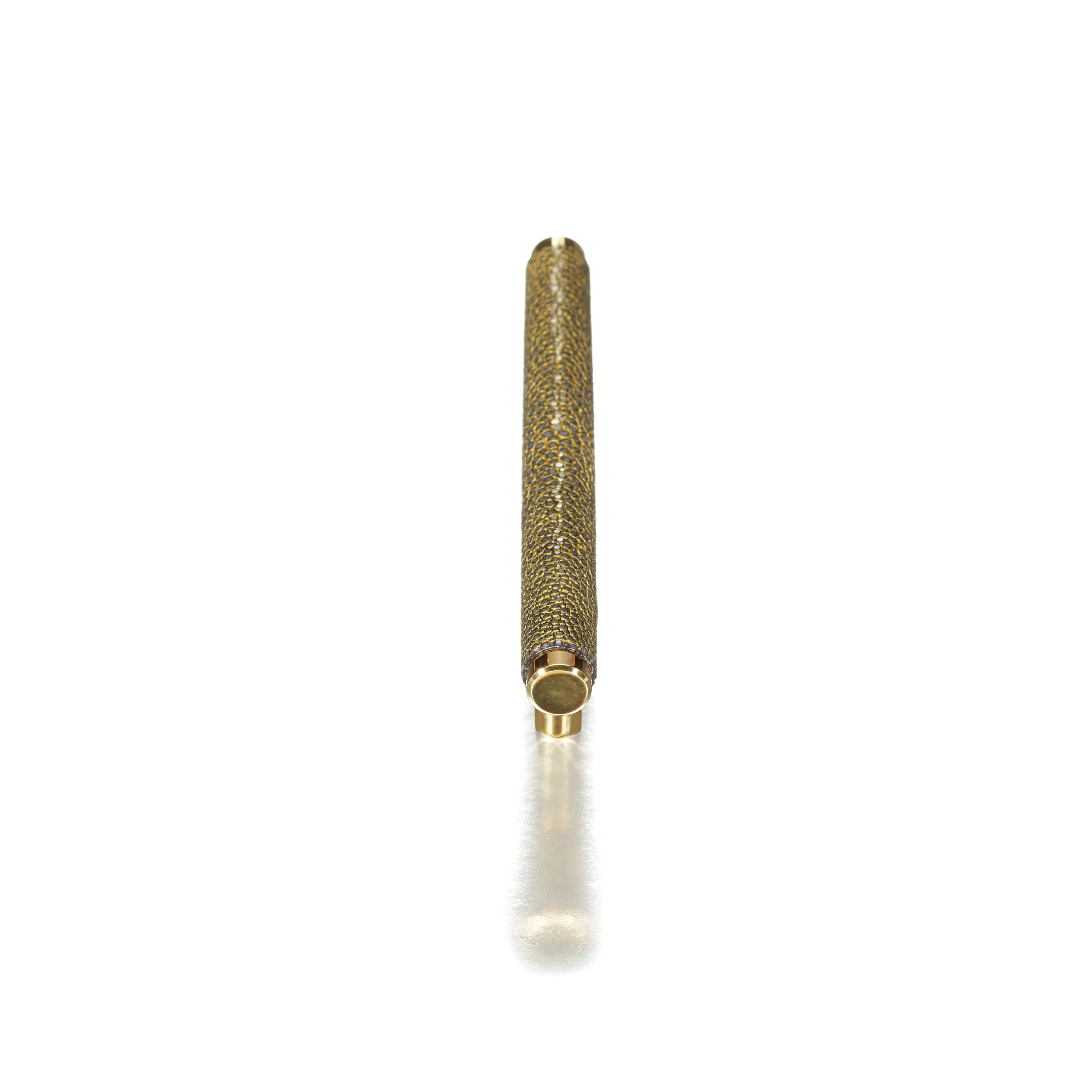 Solid brass and wrapped, hand-dyed shagreen cabinet pull, encrusted with gold.